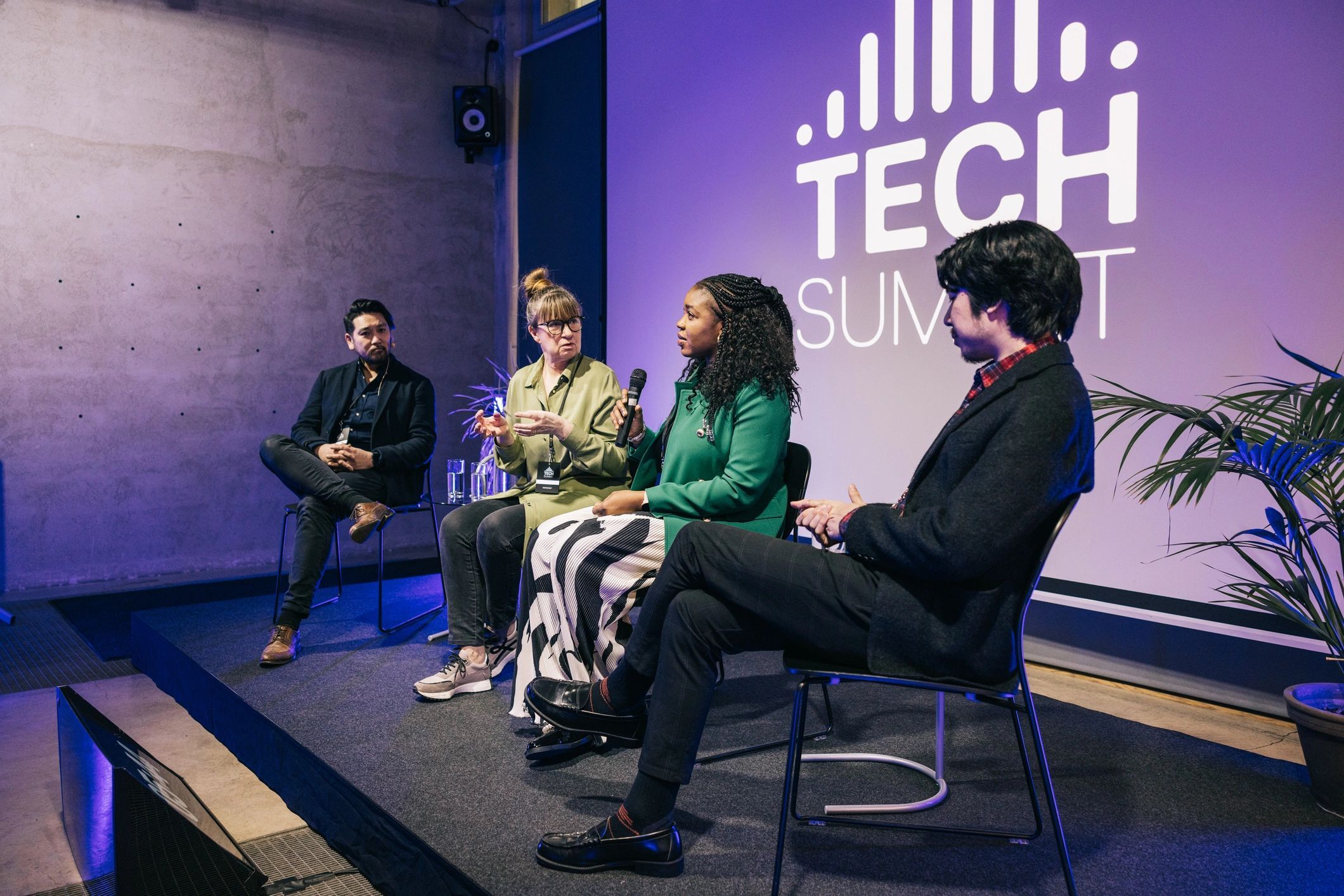 a black and white living room with a large tv