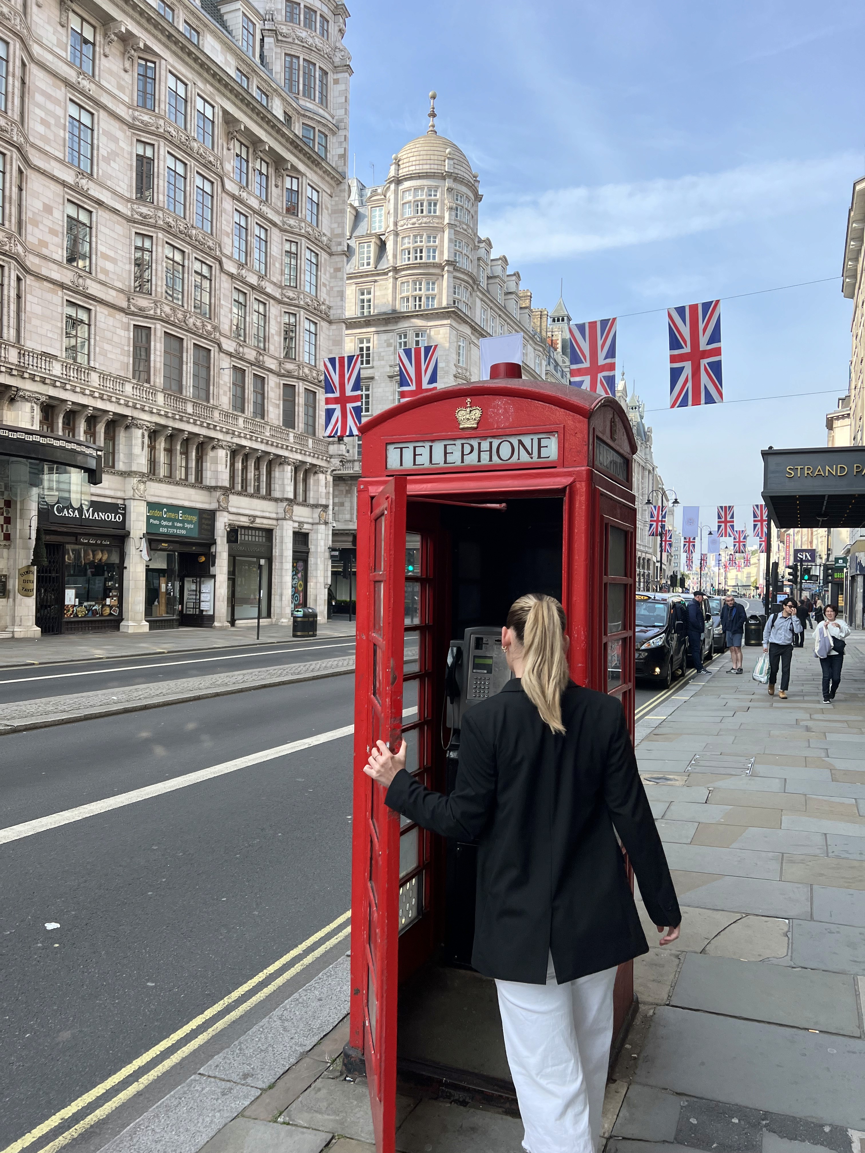 people in a large building with Tate Modern in the background