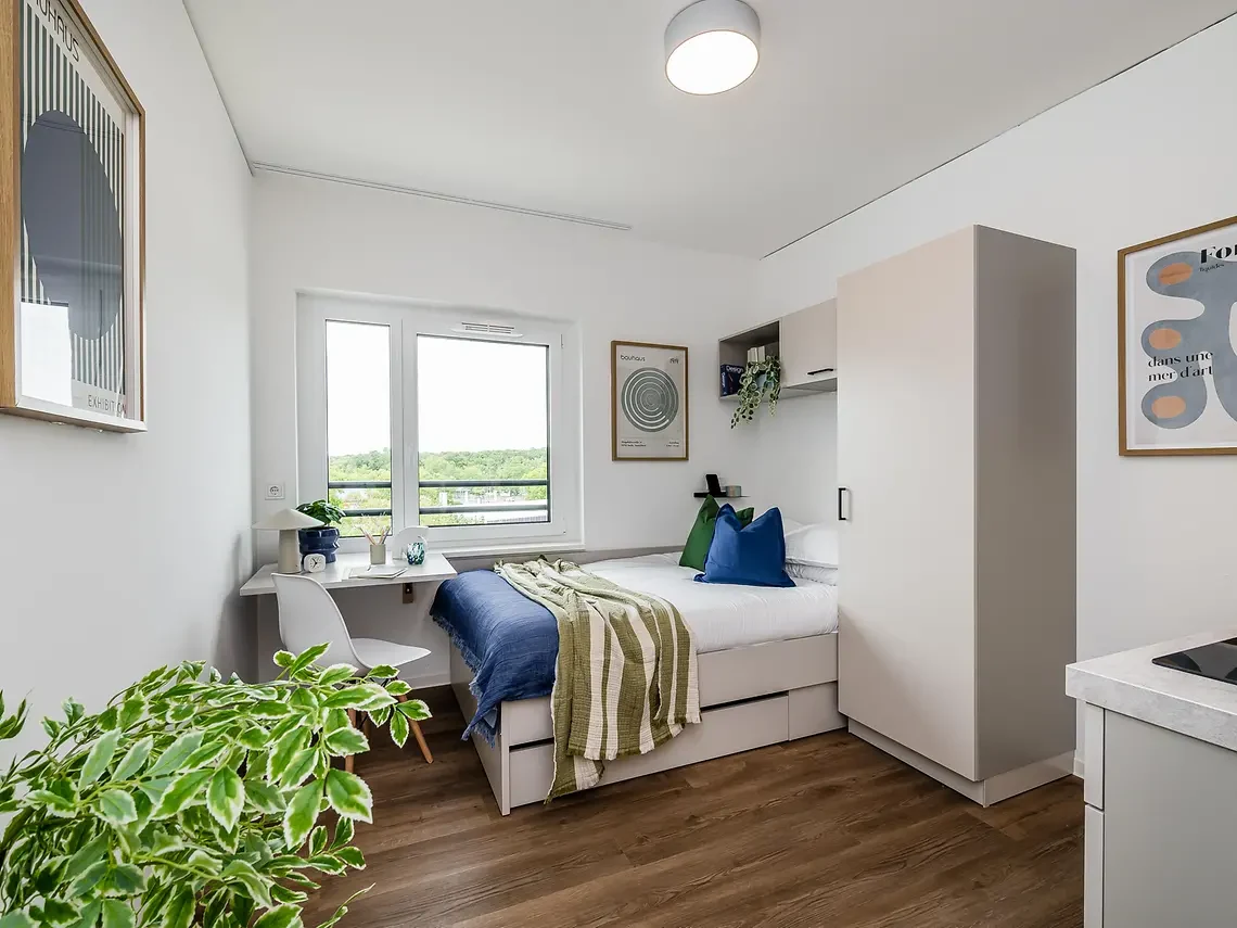 Modern private student studio in Berlin with bed, desk and storage