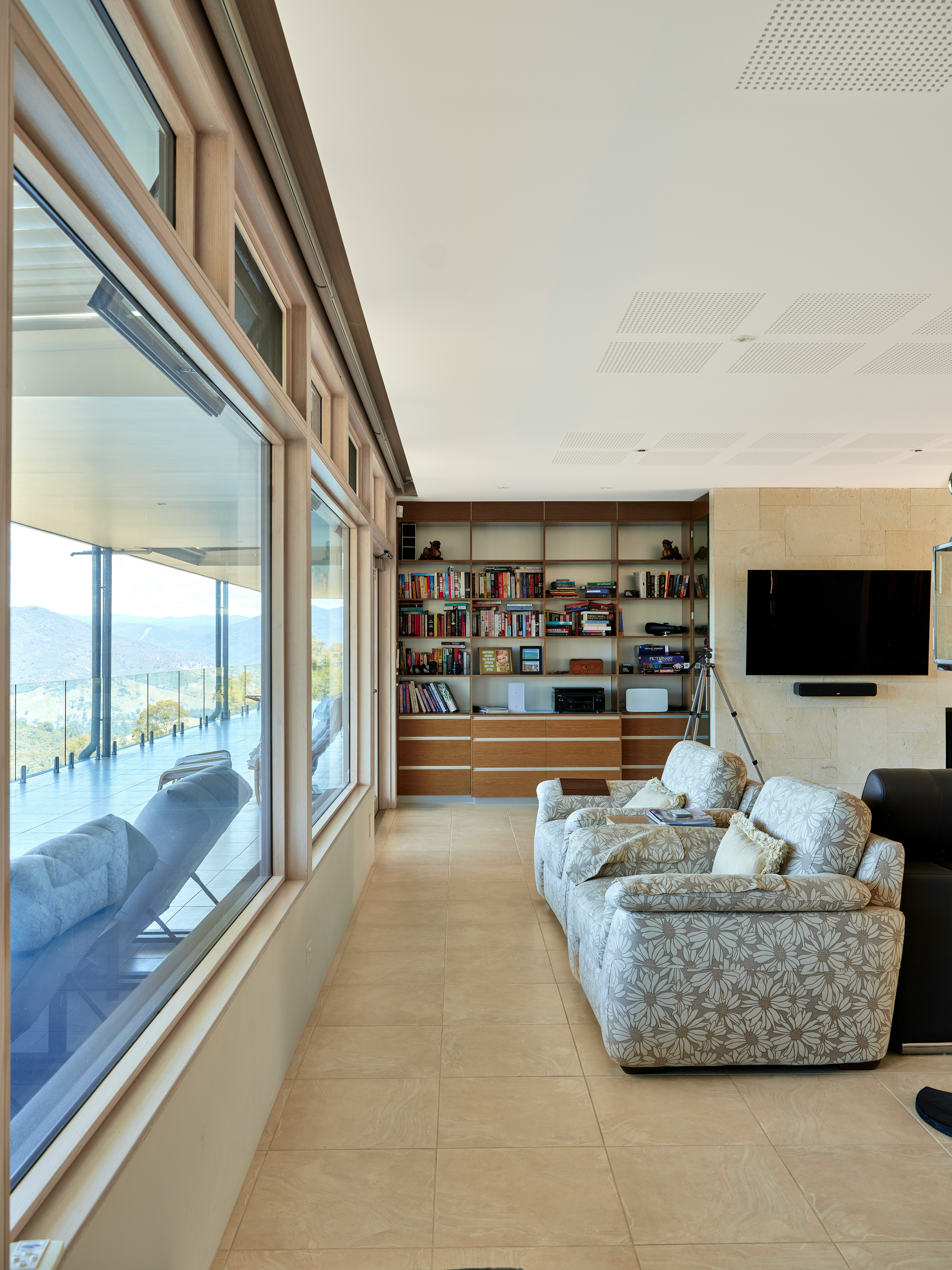 A living room filled with furniture and a flat screen TV