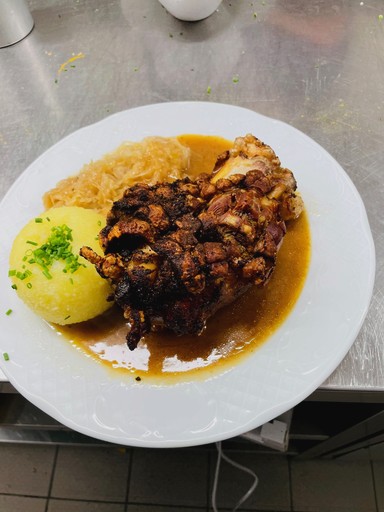 Close-up of a tree stump showing growth rings and a textured brown wood surface.