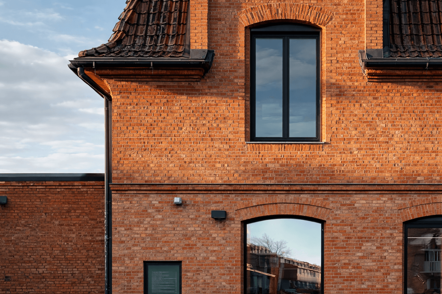 KKN Ingenieurbüro GmbH Engineering Hub Zwickau. Close-up of the brick industrial building, emphasizing German engineering precision and production feasibility.