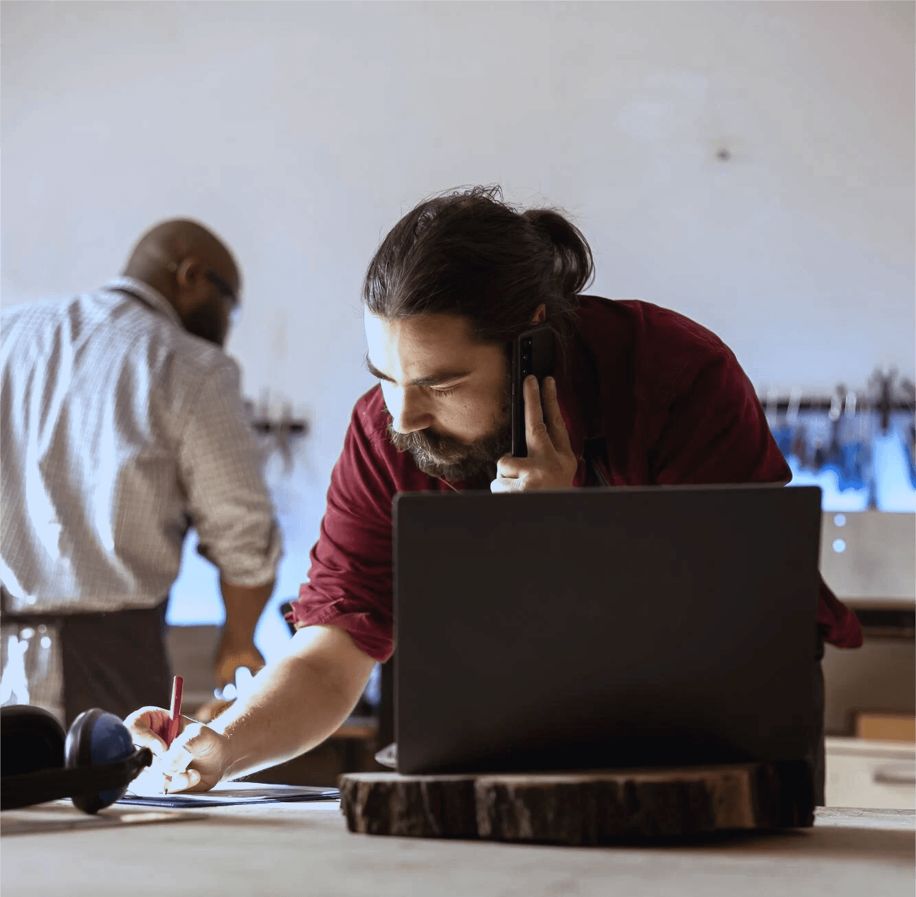 man sitting on couch using MacBook