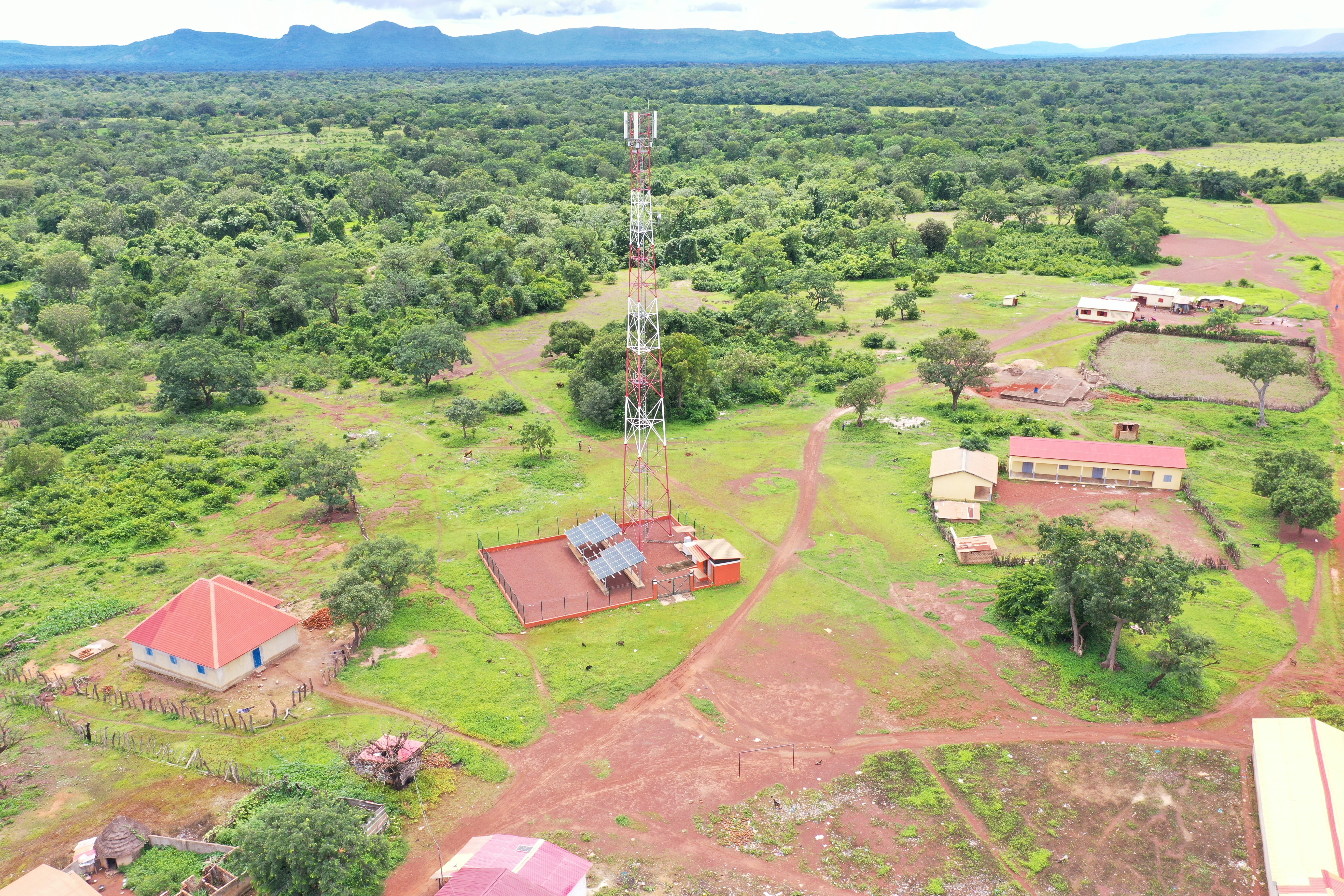 person climbing in electricity tower