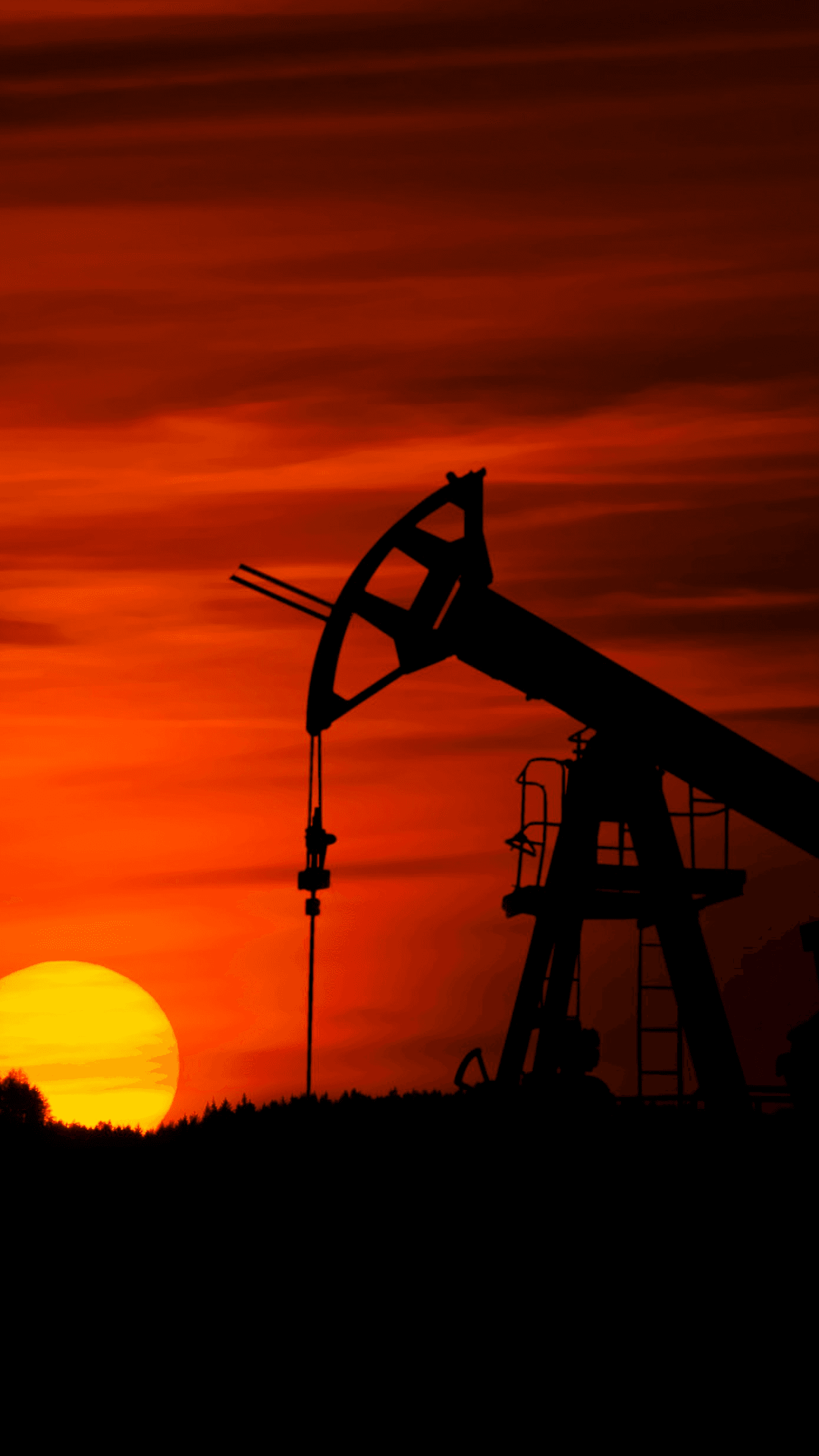 Smiling young woman with long hair standing against a dark green background, holding a finger to her chin.
