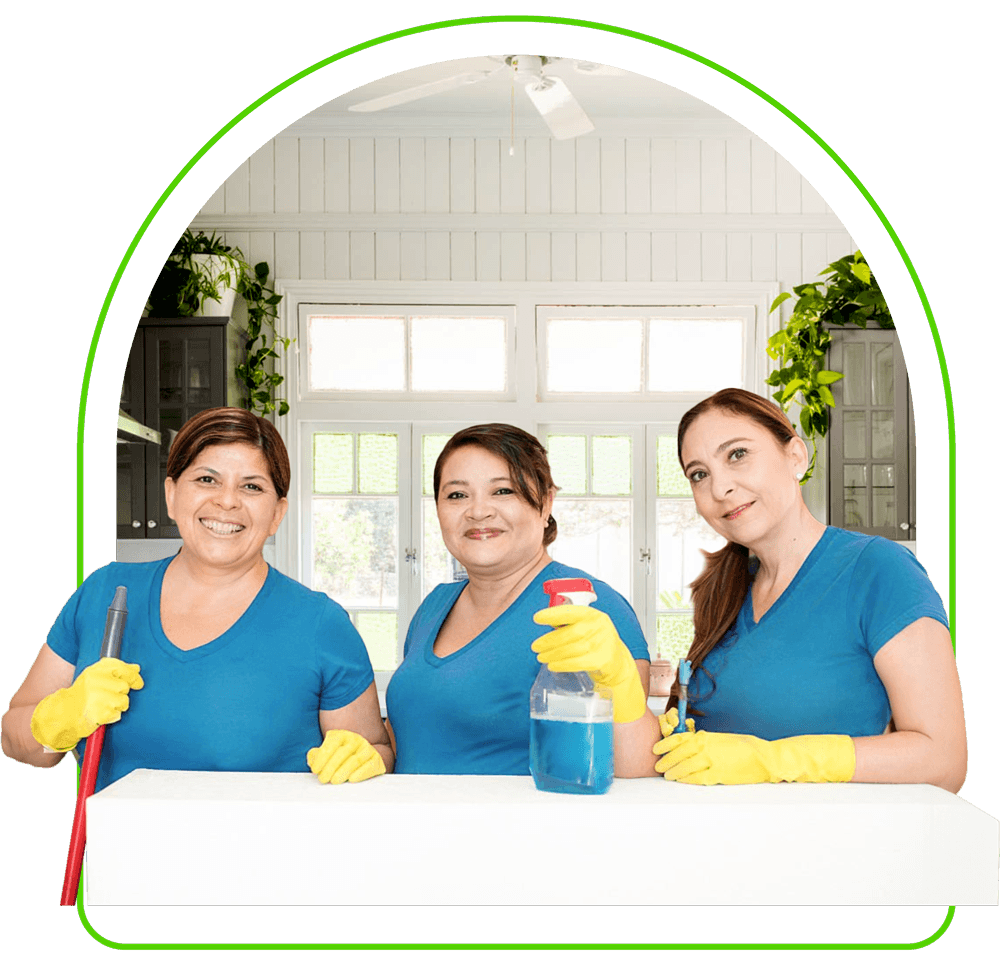 three Justo Cleaning maids cleaning kitchen