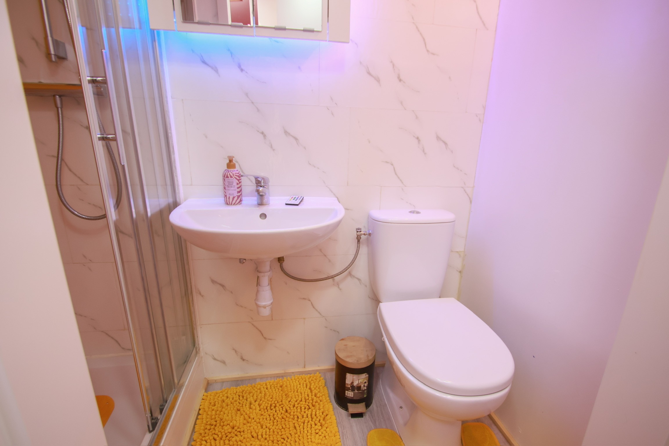 Classic bedroom with canopy bed and patterned pillows