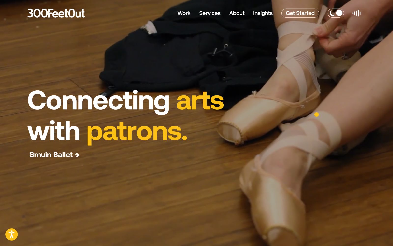 Ballet dancer adjusting pointe shoes on wooden floor. Text: "Connecting arts with patrons. Smuin Ballet." Website menu at the top.