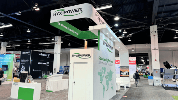 HyxiPower RE+ Southeast 2024 clean energy booth with hanging sign, residential energy storage display, branded wall graphics, and open visitor flow