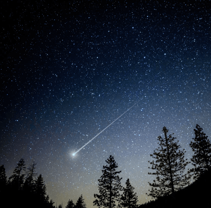 White building with red lighthouse under clear sky.