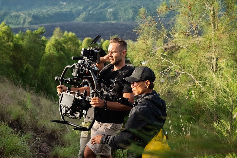 We Do Creative DOP and local crew operating a cinema gimbal rig on a volcanic highland location in Bali during a commercial production shoot