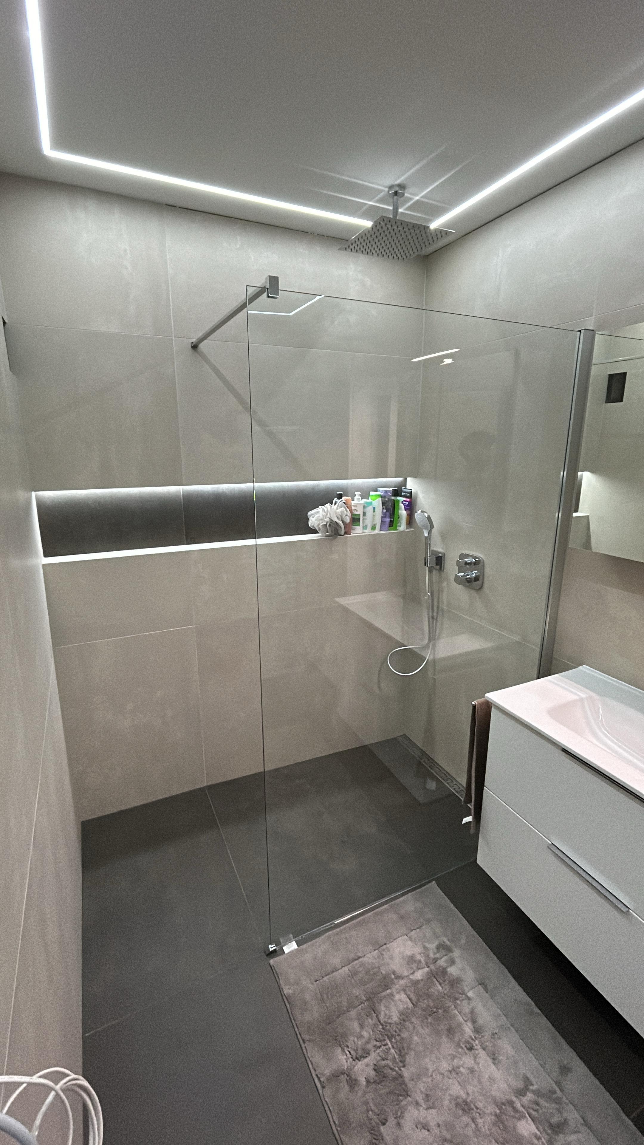 Futuristic residential architecture with cantilevered orange sections and integrated green spaces, reflecting the architect's innovative vision