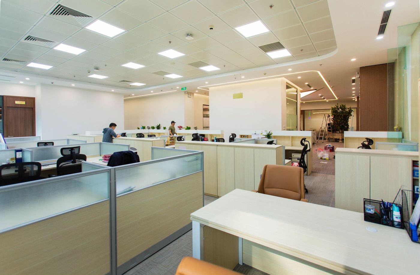 Spacious modern office with open cubicles and clean workstations