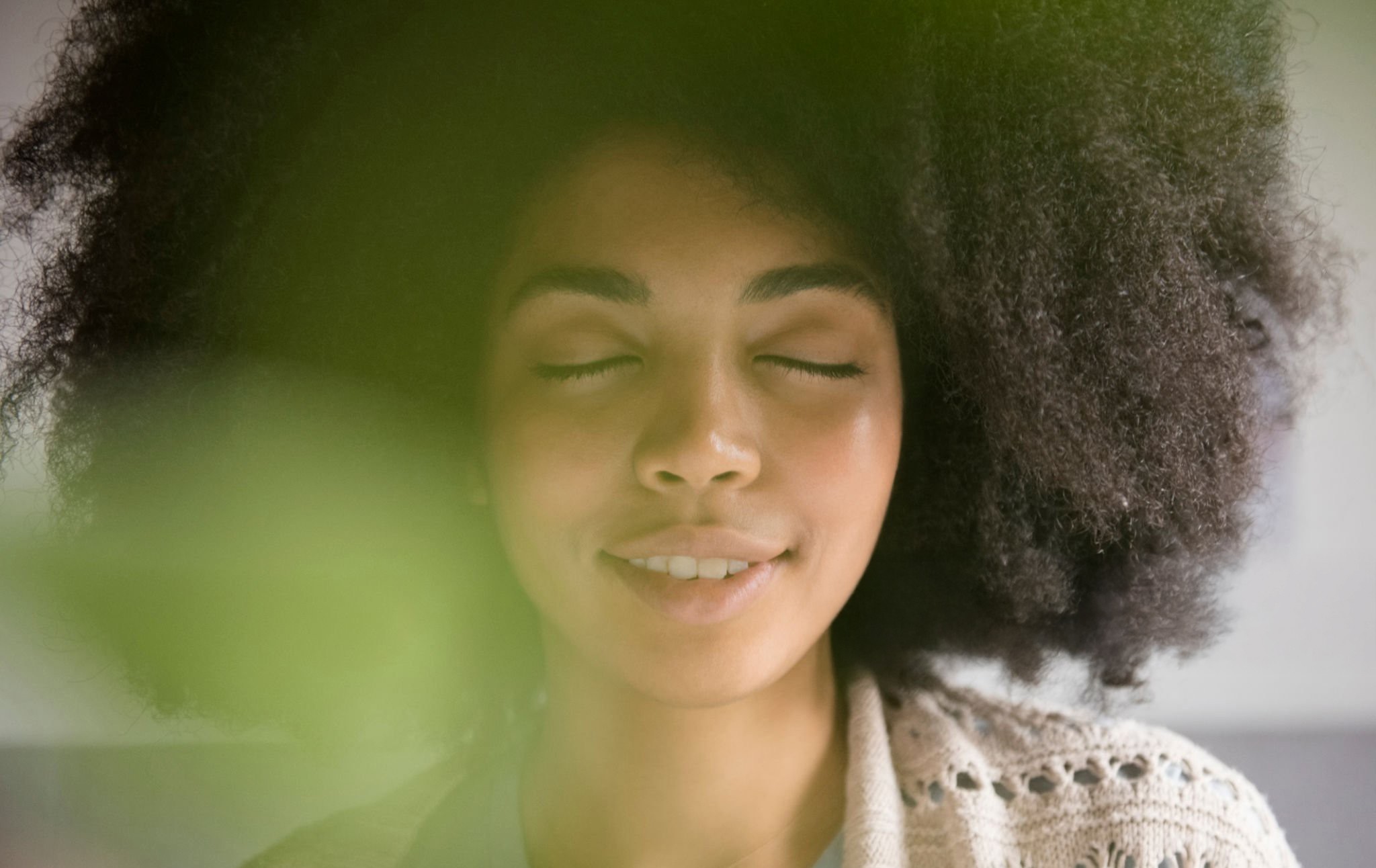 A peaceful person that looks satisfied by their growth