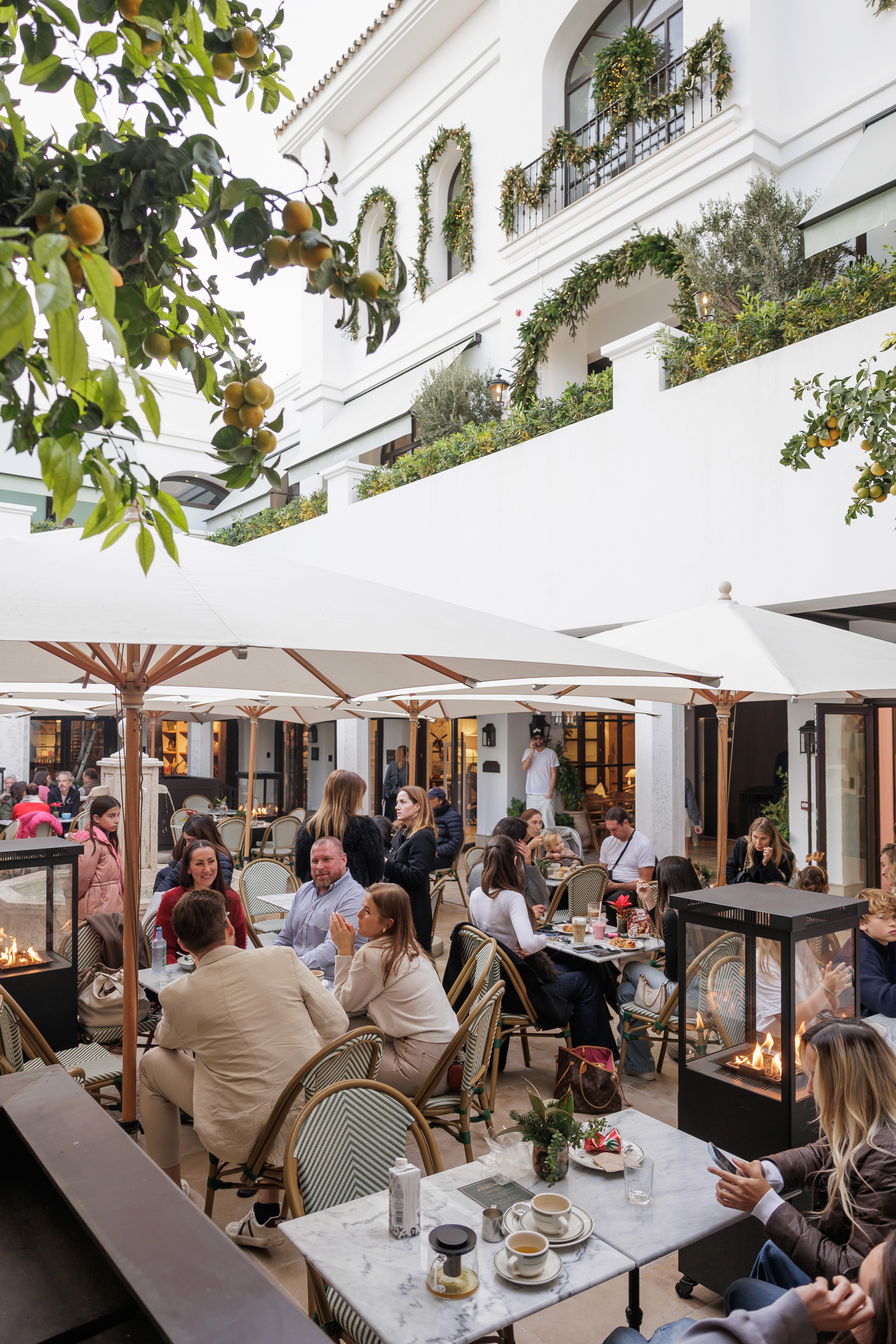 A close-up shot of a handcrafted welcome cocktail served at a Mediterranean hotel patio