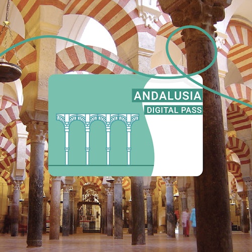 La imagen muestra el interior de un edificio con arcos y columnas, superpuesto con un gráfico de "ANDALUSIA DIGITAL PASS".