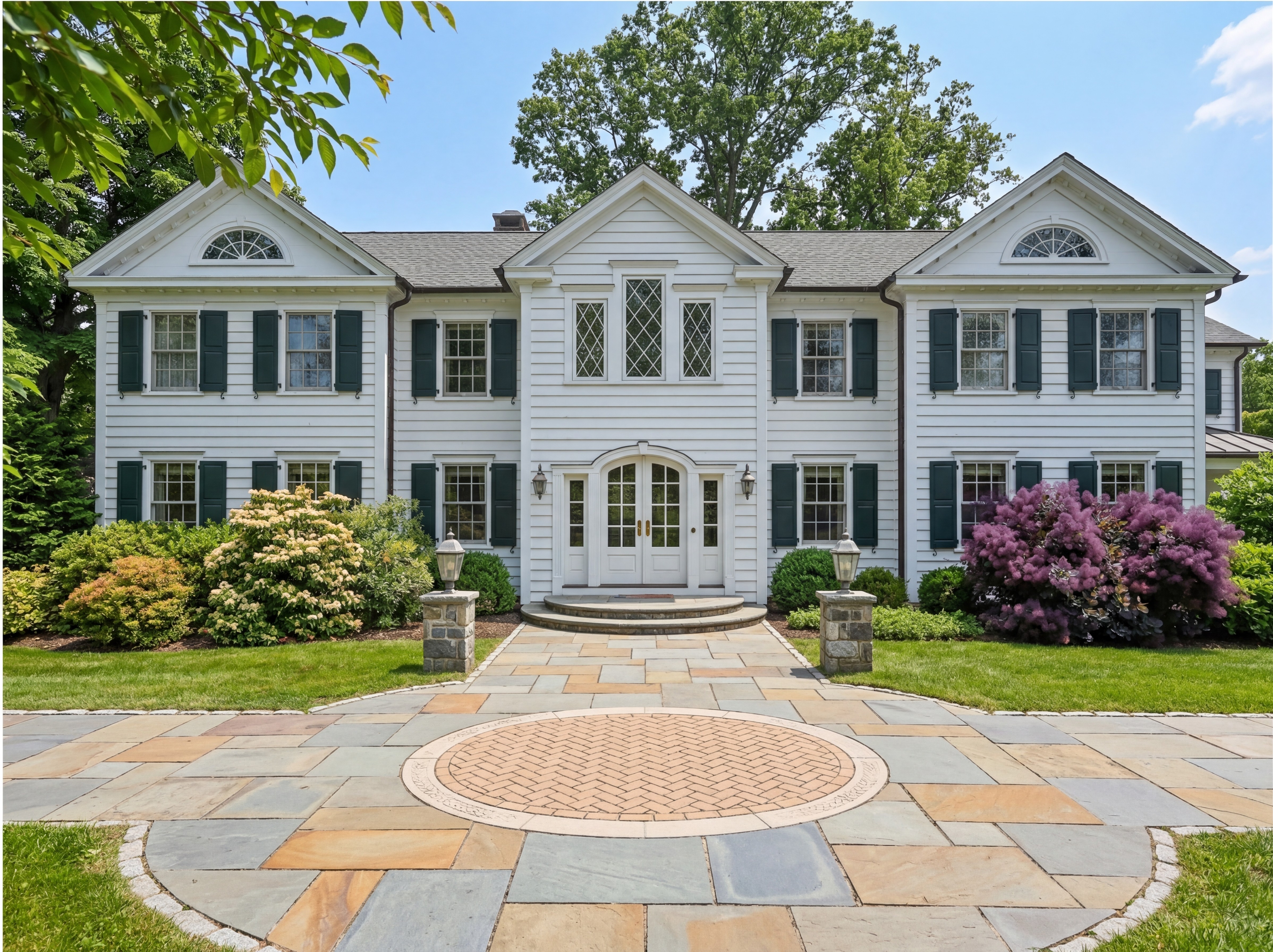 White house with stone symetrical path.