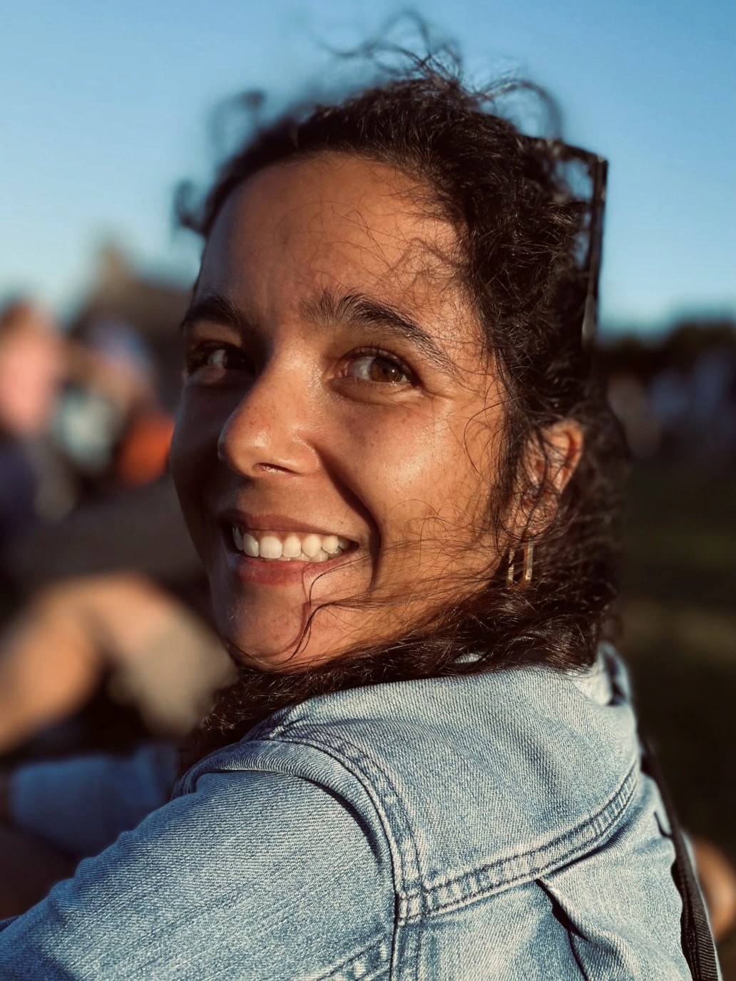 Julieta, a product designer happily smiling in the sun