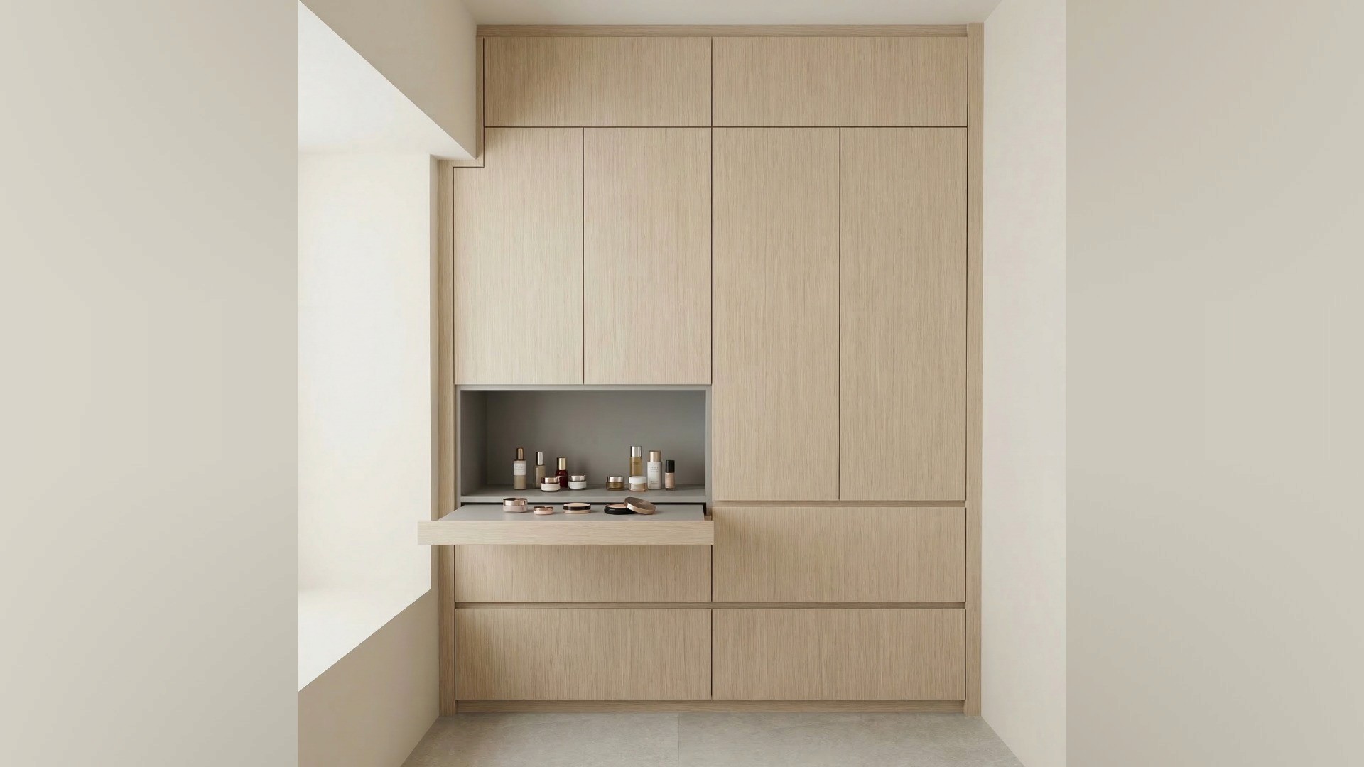 Tucked discreetly within the built-in cabinetry, a pull-out vanity shelf demonstrates the clever residential design solutions provided by CCPY Interior for modern lifestyle needs.