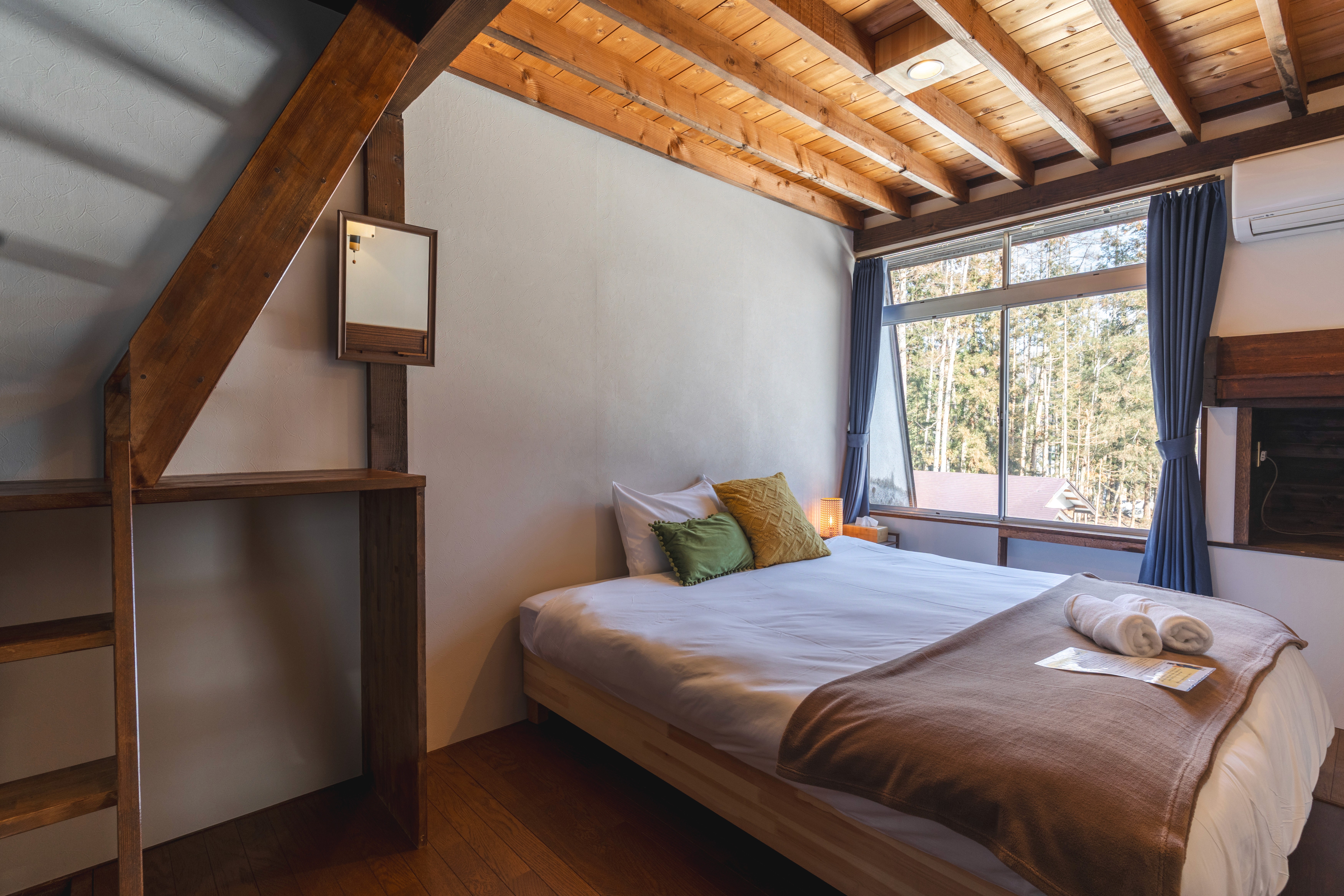 A cosy room with traditional Japanese design elements. The twin beds can be joined to create a spacious king bed. Ideal for couples or friends seeking a cultural experience.