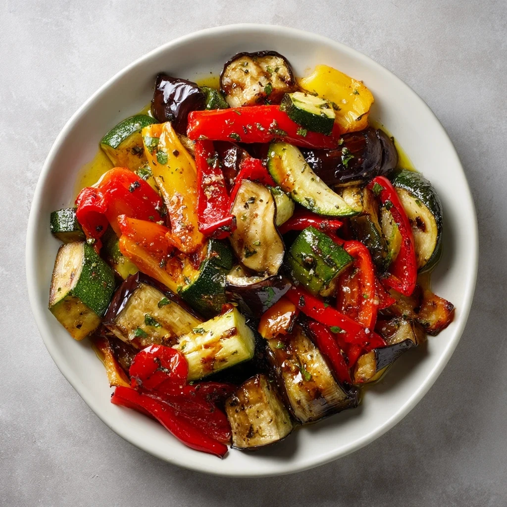 Vegetables on a plate dripped in OYM olive oil