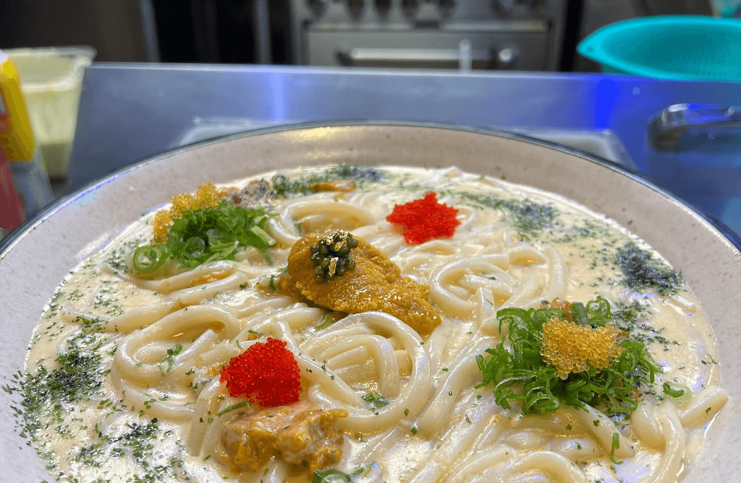 Luxurious uni udon from Izakaya Tora, featuring creamy sea urchin and thick Japanese udon noodles, a must-try fusion dish in West Hollywood.