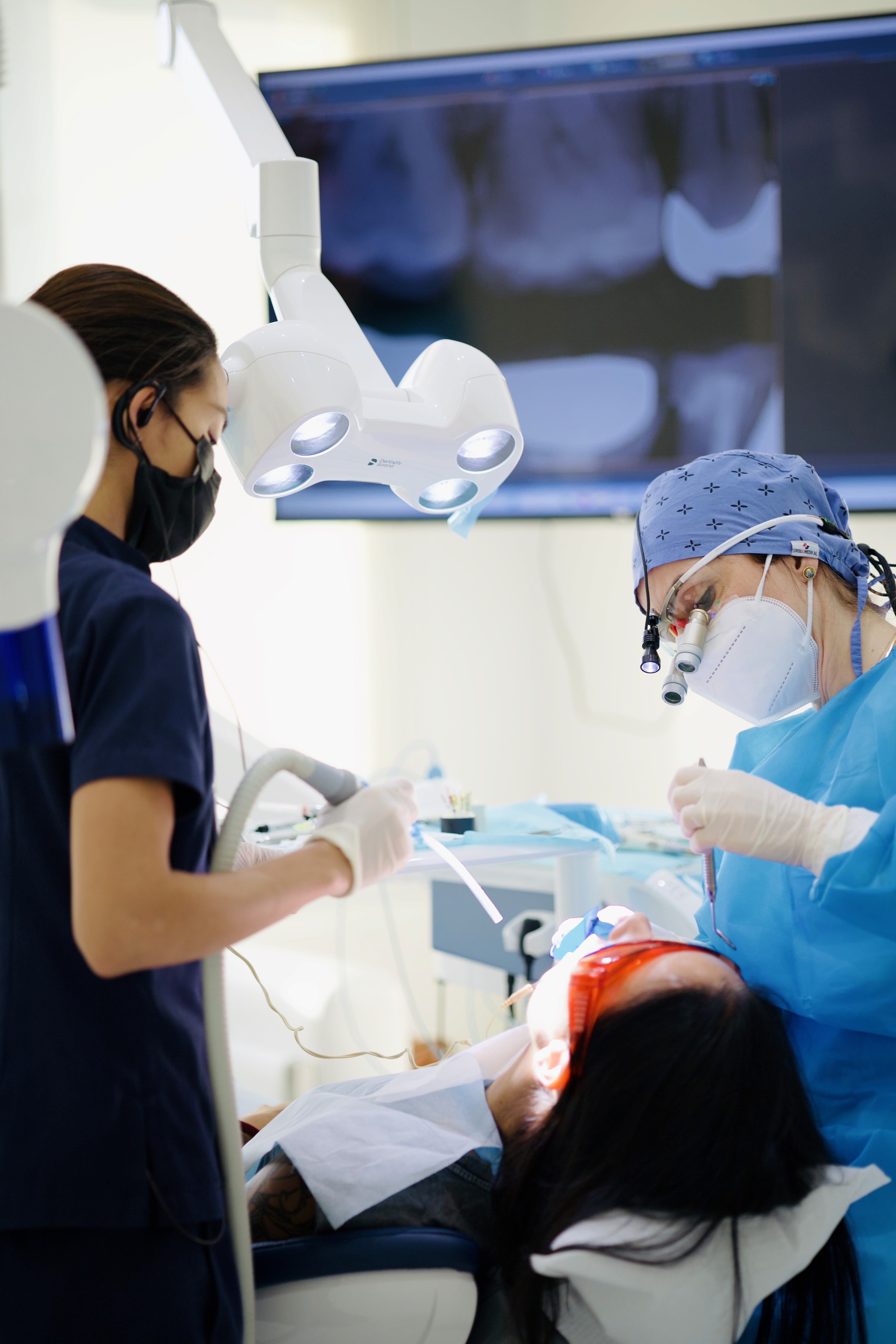 Gummy smile procedure showing a cosmetic dentist performing precise techniques while keeping the patient comfortable and relaxed.