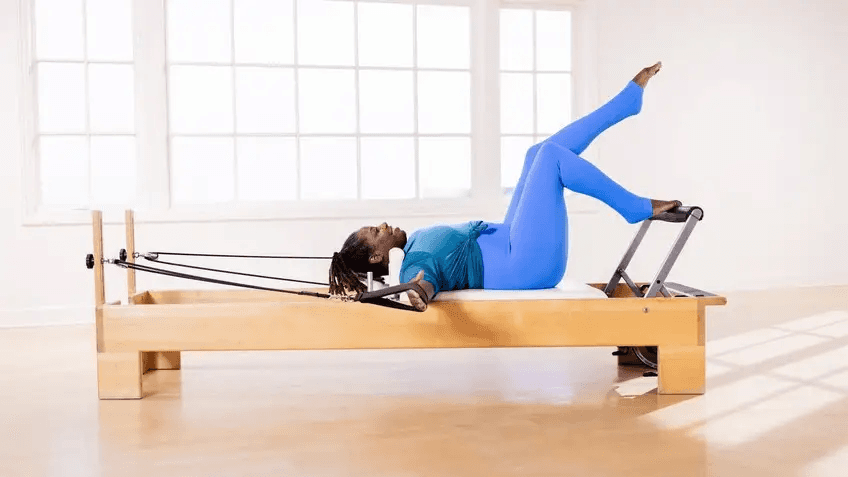Pilates Reformer Leg Exercises - adductor squeeze in straps