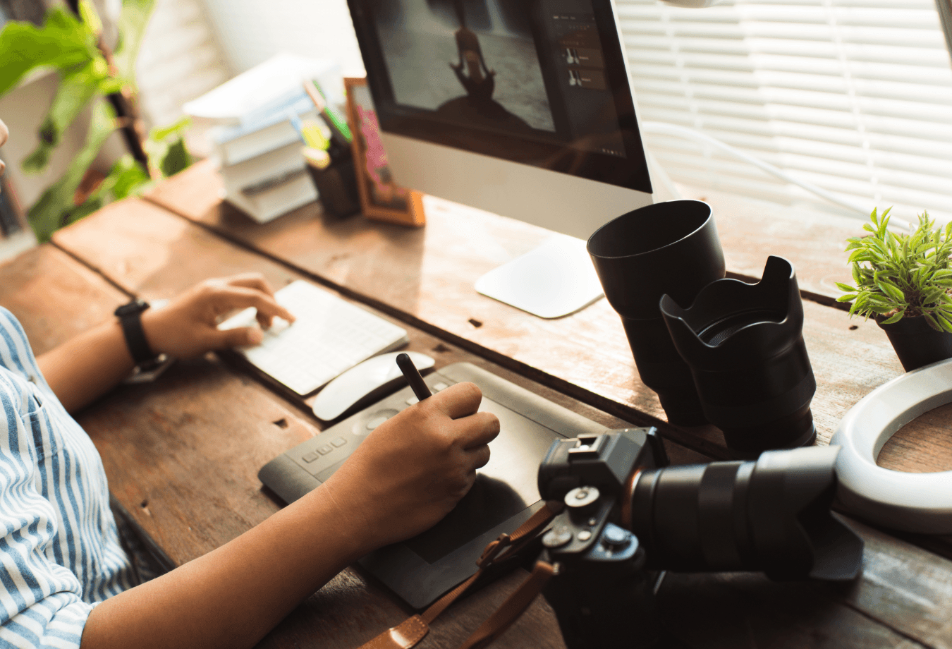 A large group photo of diverse team members gathered in an industrial-style space with arched ceiling.