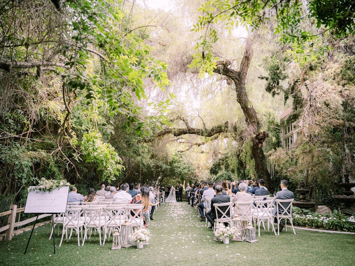 Green Gables Estate wedding venue in San Marcos with trees, garden pathway, and natural outdoor setting