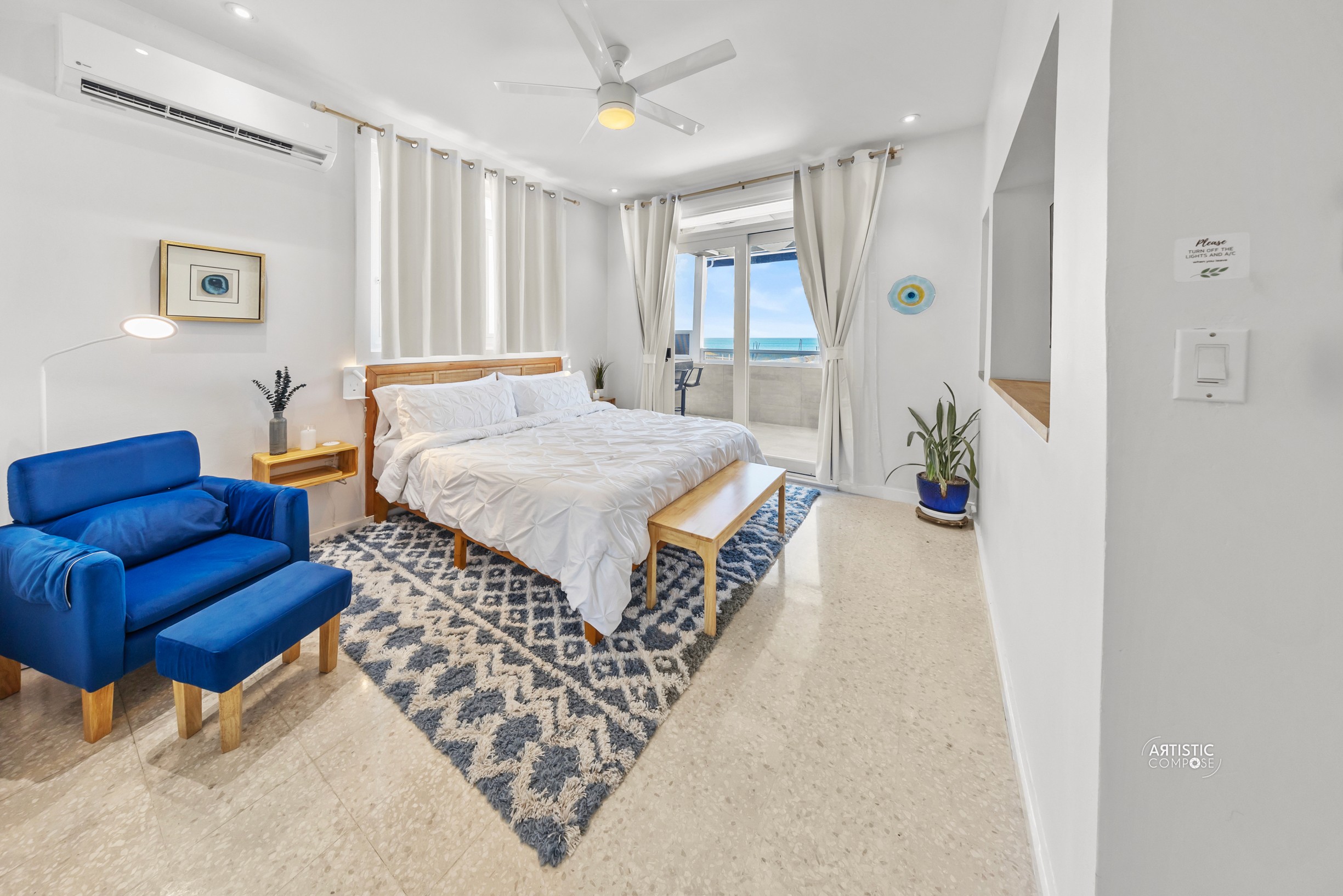 Three models standing in a wheat field, wearing beige suits.