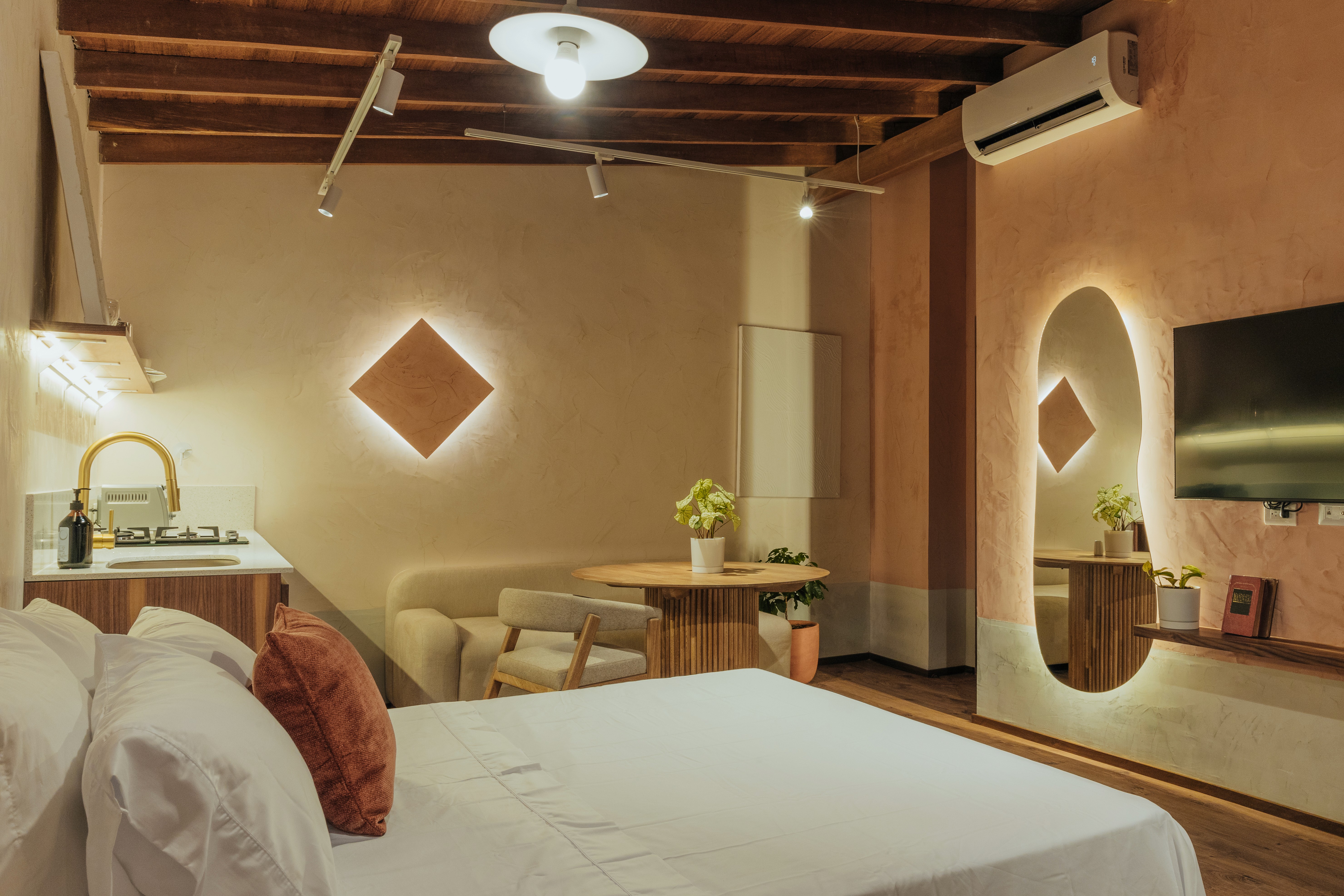 Double-height interior with flowing sculptural forms and warm raking light