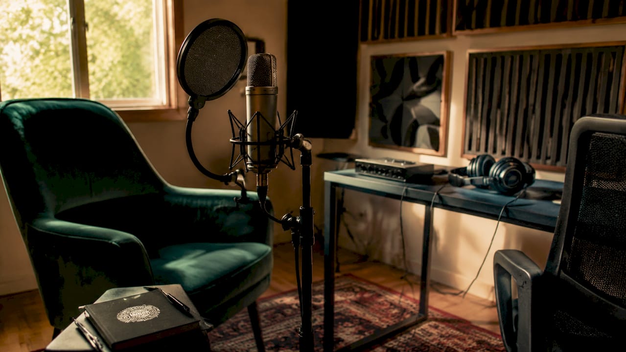 Home vocal recording room with mic and acoustic treatment