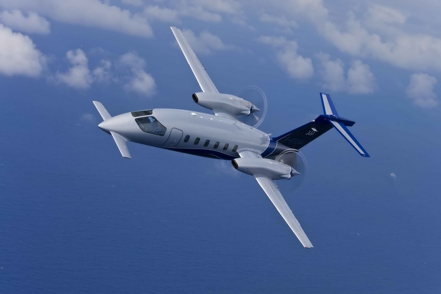 The Piaggio Avanti II is an Italian twin-engine turboprop aircraft produced by Piaggio Aero Industries. It is a unique looking aircraft with a forward wing design, and it is known for its speed, efficiency, and range.      Here are some of the specifications and features of the Piaggio Avanti II:     Engines: Two Pratt & Whitney Canada PT6A-66B turboprop engines, each producing 850 shp  Maximum cruise speed: 463 knots (539 mph, 868 km/h)  Range: 1,980 nautical miles (2,277 miles, 3,667 km)  Maximum altitude: 41,000 ft (12,497 m)  Maximum take-off weight: 12,100 lbs (5,488 kg)  Cabin dimensions: Length 14.11 ft (4.30 m), Height 4.9 ft (1.49 m), Width 6.1 ft (1.85 m)  Seating capacity: Up to 9 passengers (typically seats 6-7 passengers)  Baggage capacity: 44 cubic feet (1.2 cubic meters)     Compared to its predecessor, the Avanti II features several improvements, including more powerful engines, increased speed, a longer range, and an upgraded avionics suite. The aircraft also has a quieter cabin and improved fuel efficiency.      The cabin is well-appointed and comfortable, with amenities such as a refreshment center, a lavatory, and ample storage space for luggage.      The forward wing design helps reduce drag and improve fuel efficiency, making the Avanti II an attractive choice for both business and personal travel.