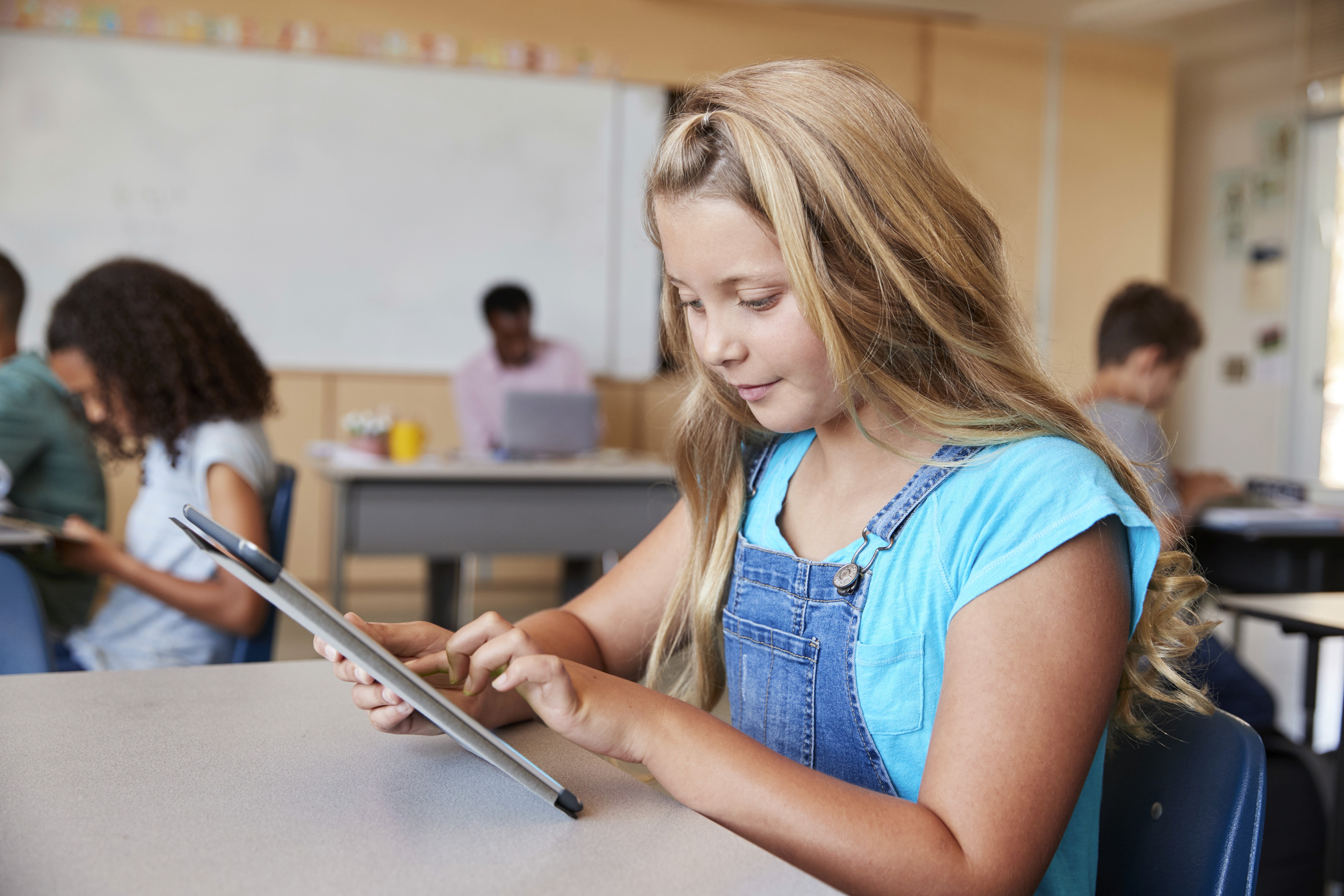 Teacher crafting AP exam multiple choice questions aligned with course skills and standards
