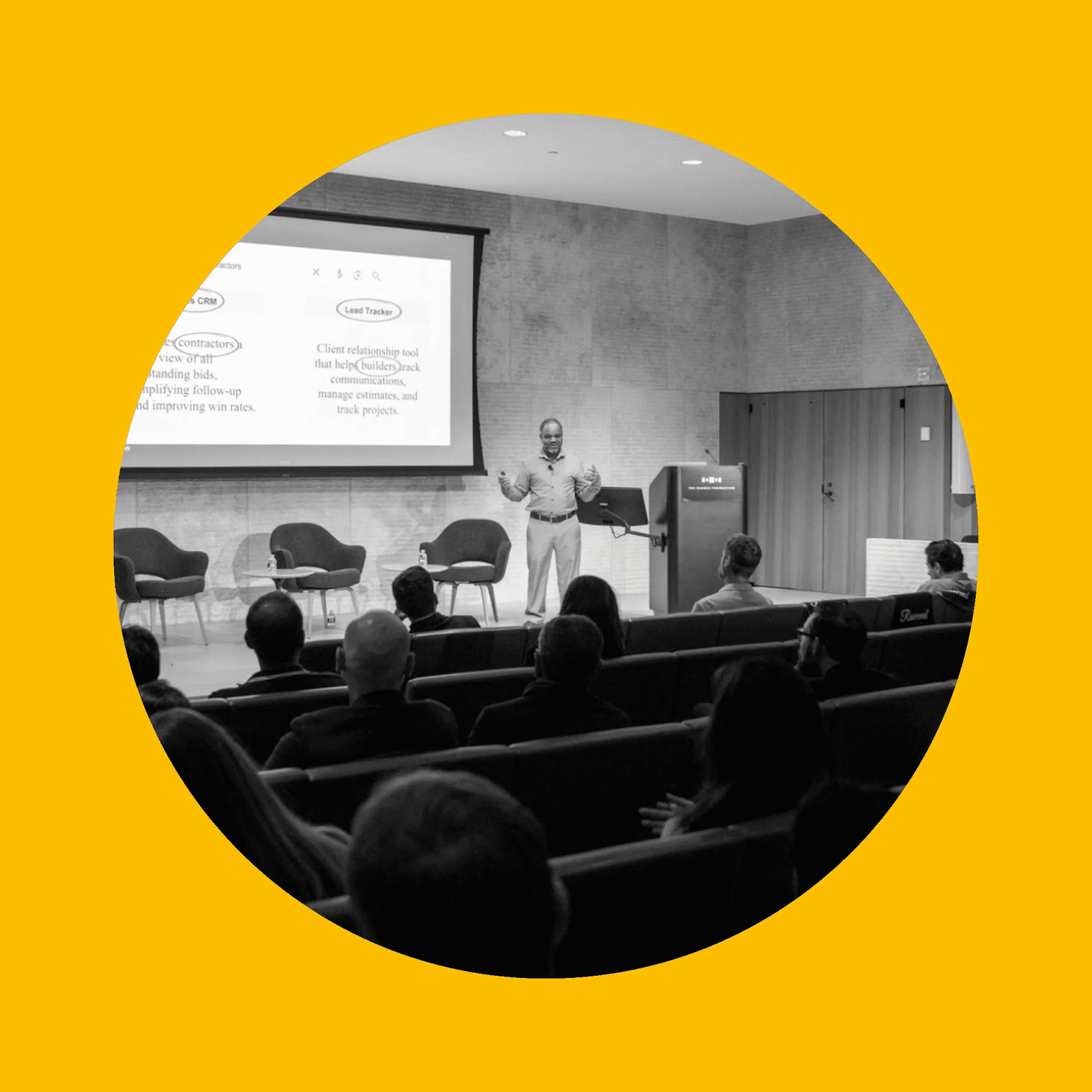Speaker presenting to an audience in a conference room