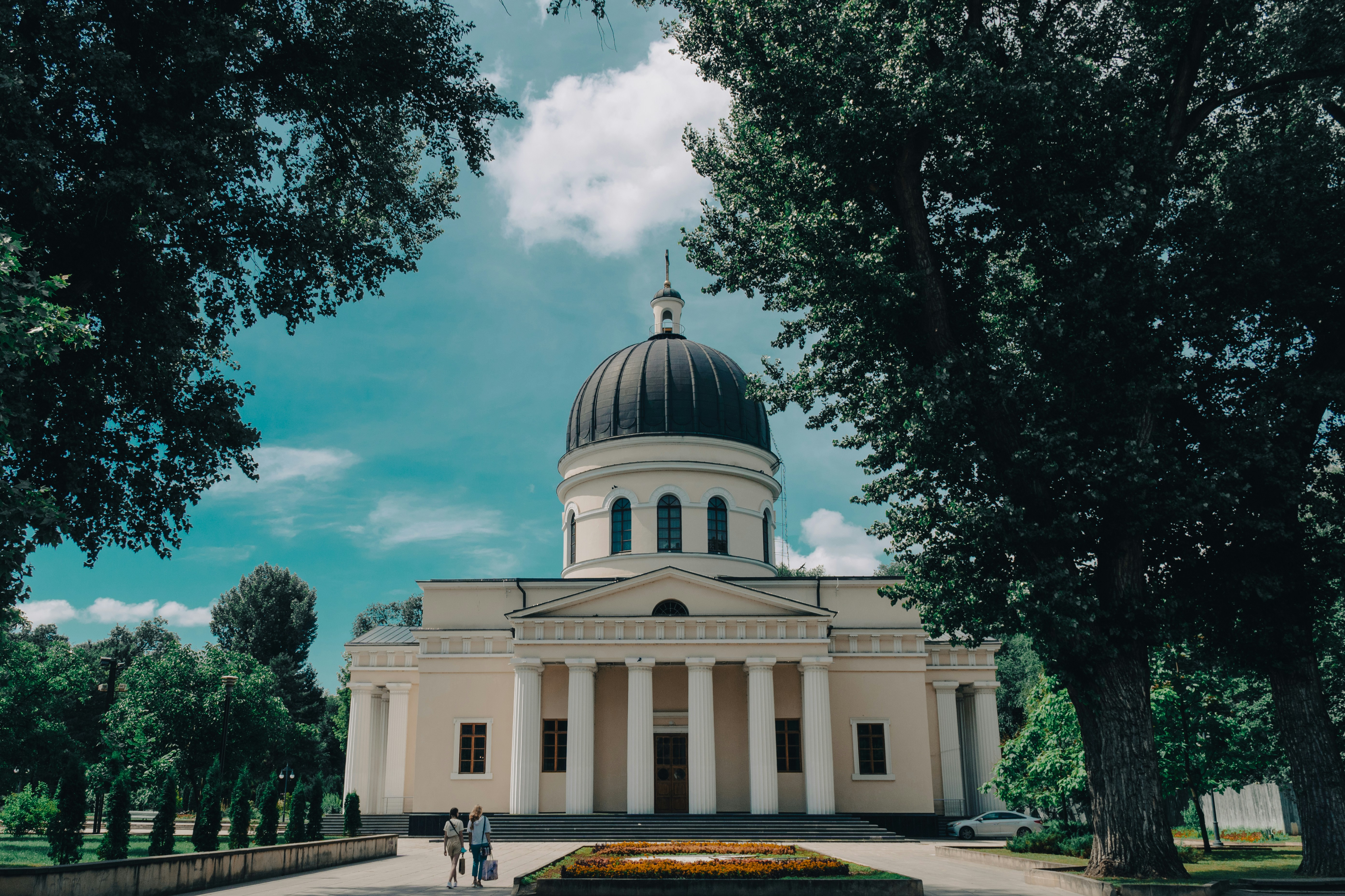 white and green dome building under blue sky during daytime
