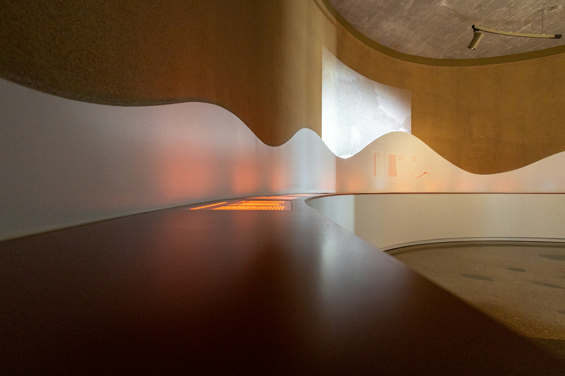 An empty room with a wooden table in it