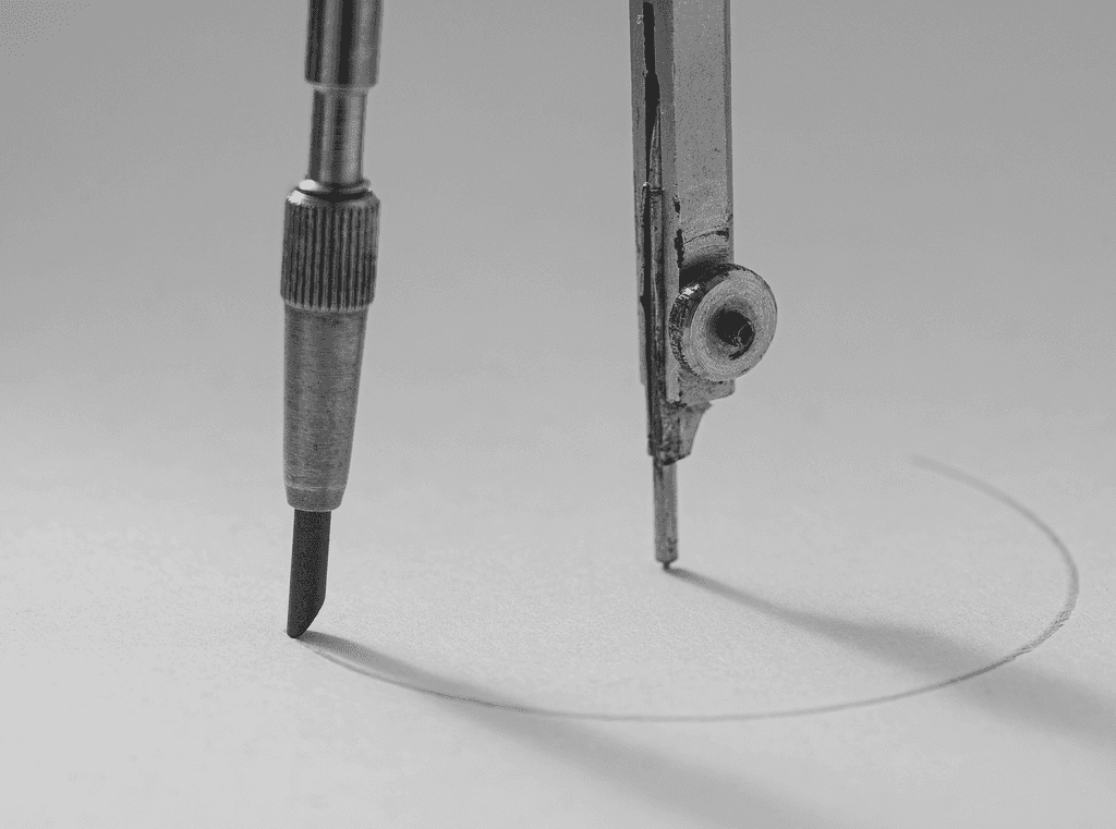 A drafting compass drawing a circle on paper.