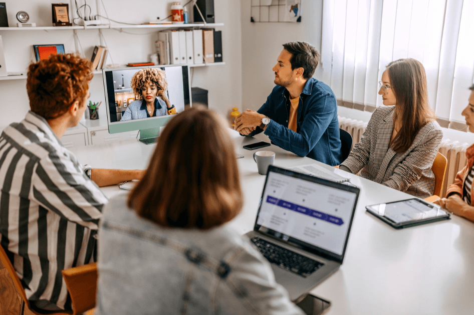 People in meeting room having a hybrid meeting