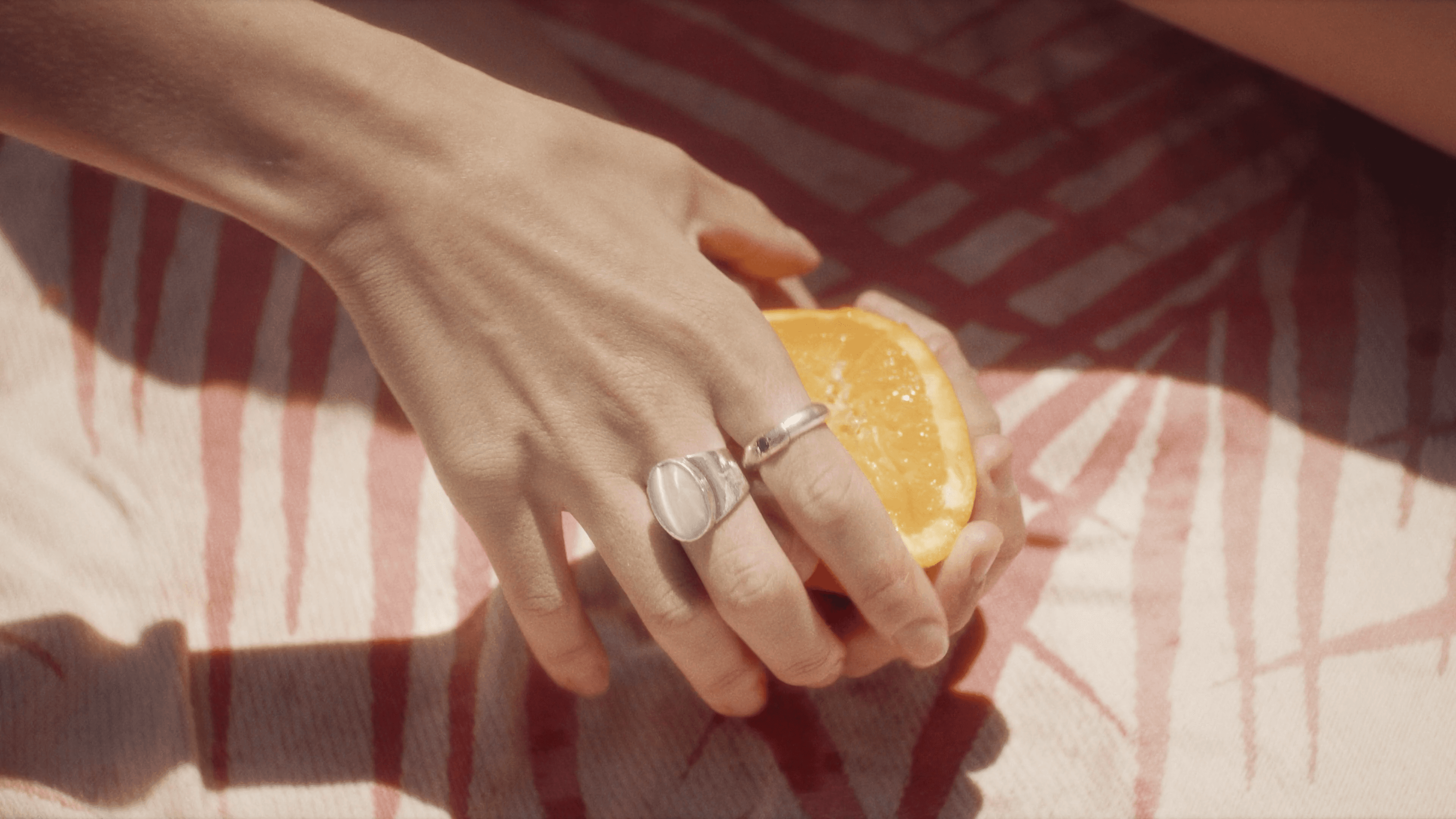 Silhouette of a person walking on a modern walkway