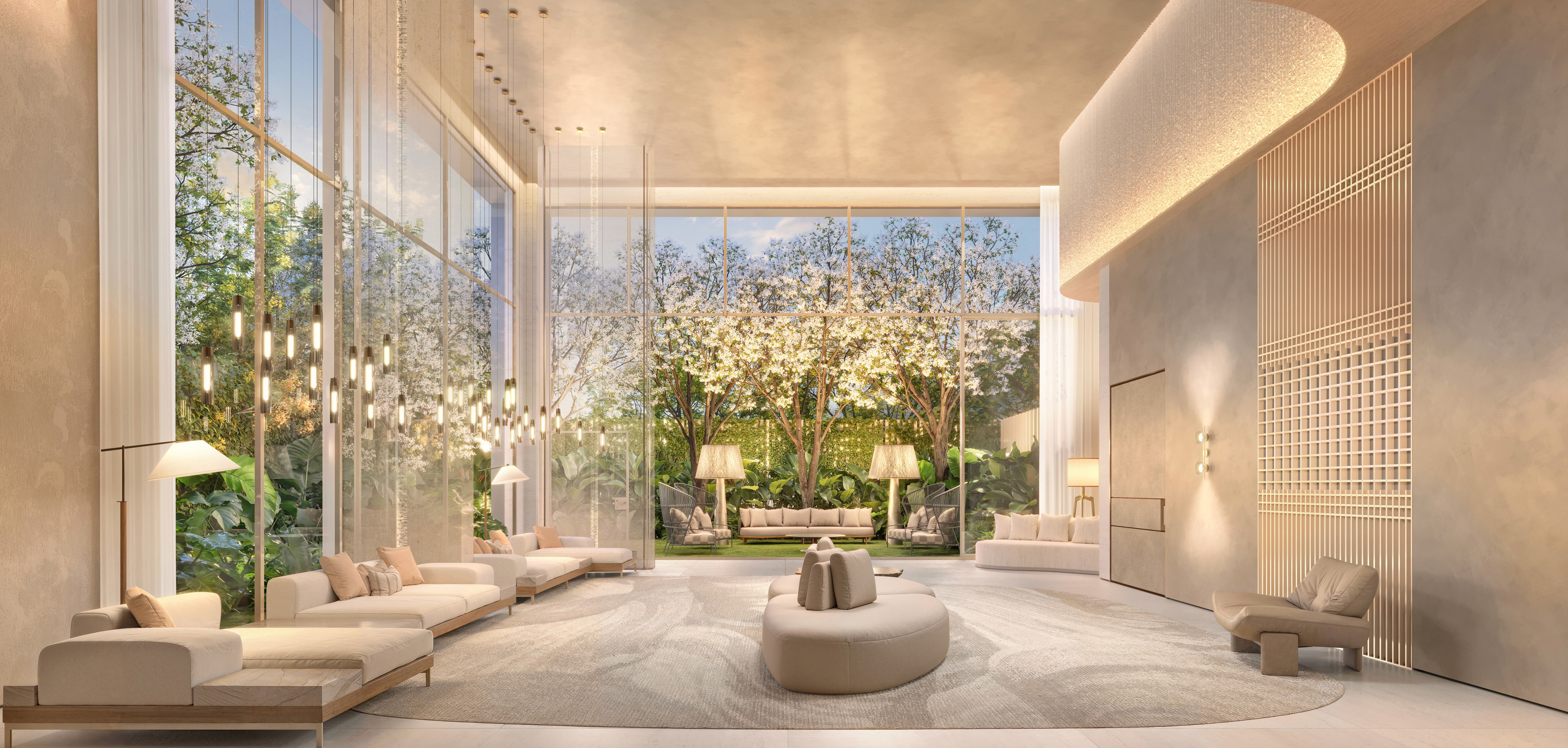 Curved modern skyscraper against a clear blue sky.