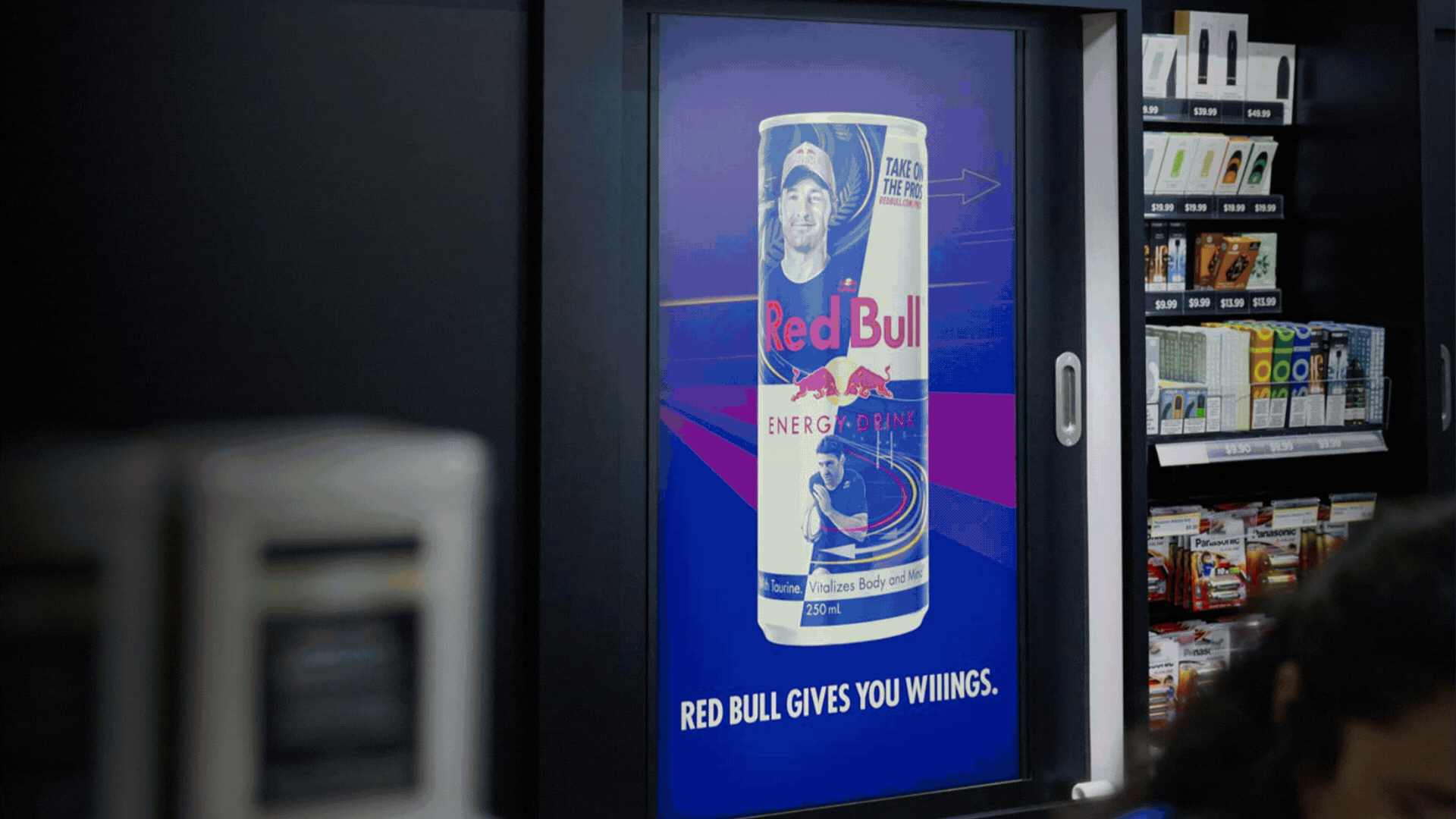 Black cosmetic product bottle against a dark background