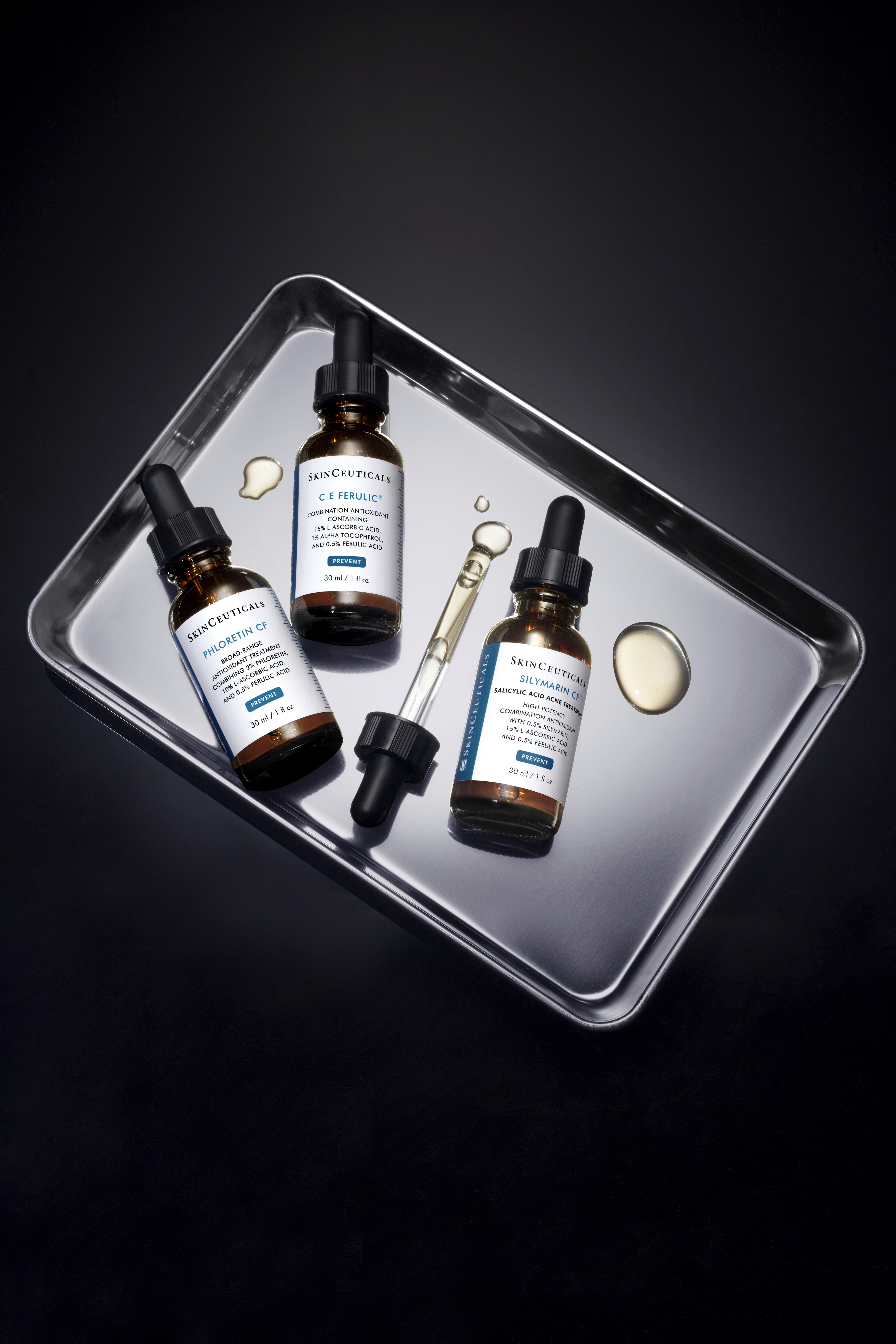 SkinCeuticals products on a metal tray.