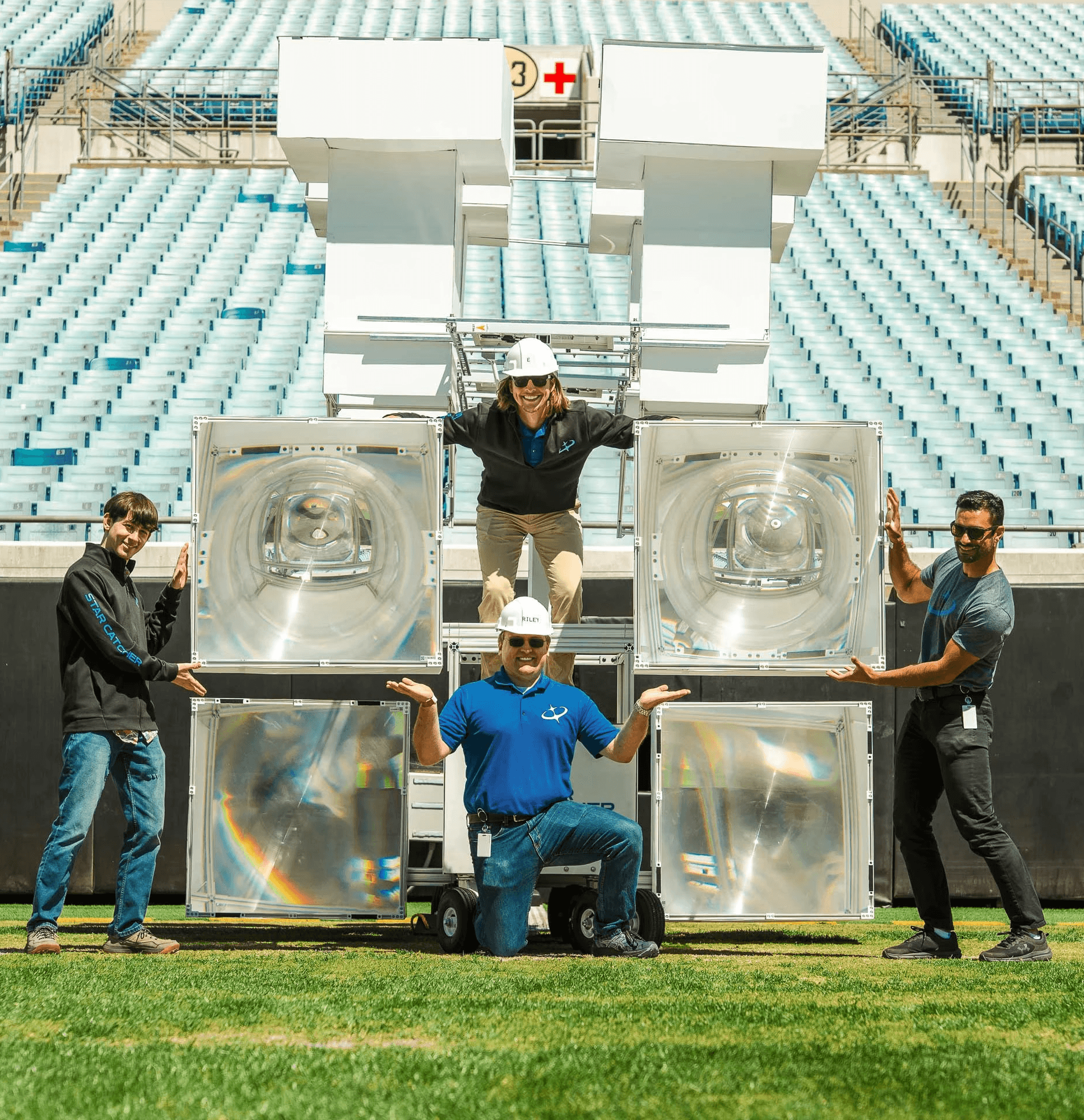 Star Catcher optics team with fresnel lens hardware at EverBank Stadium after successful first public demo