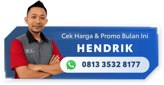 A man is standing in front of a sign