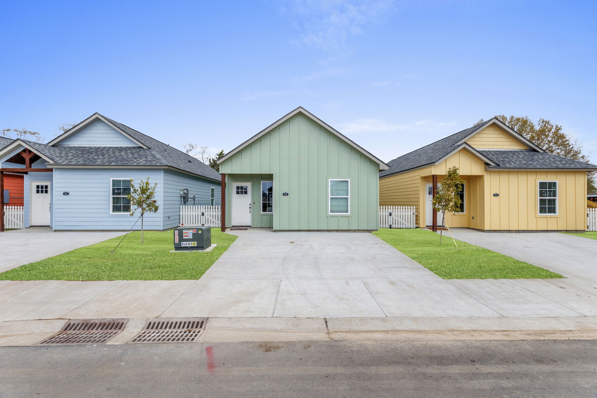 A gym room featuring several treadmills and colorful exercise balls arranged neatly around the space.