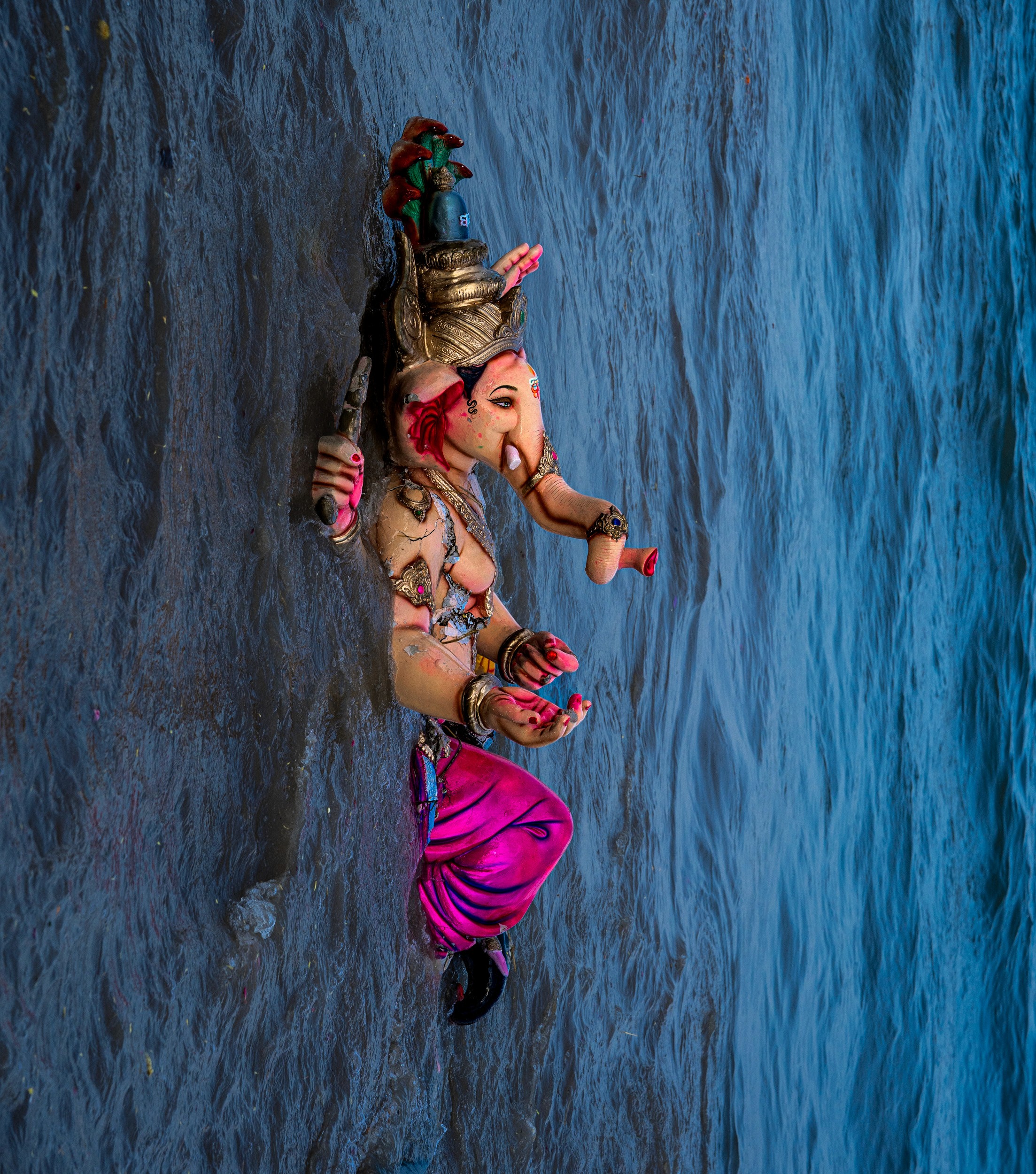 The Return — The painted earth dissolves into the deep blue, returning to the source.