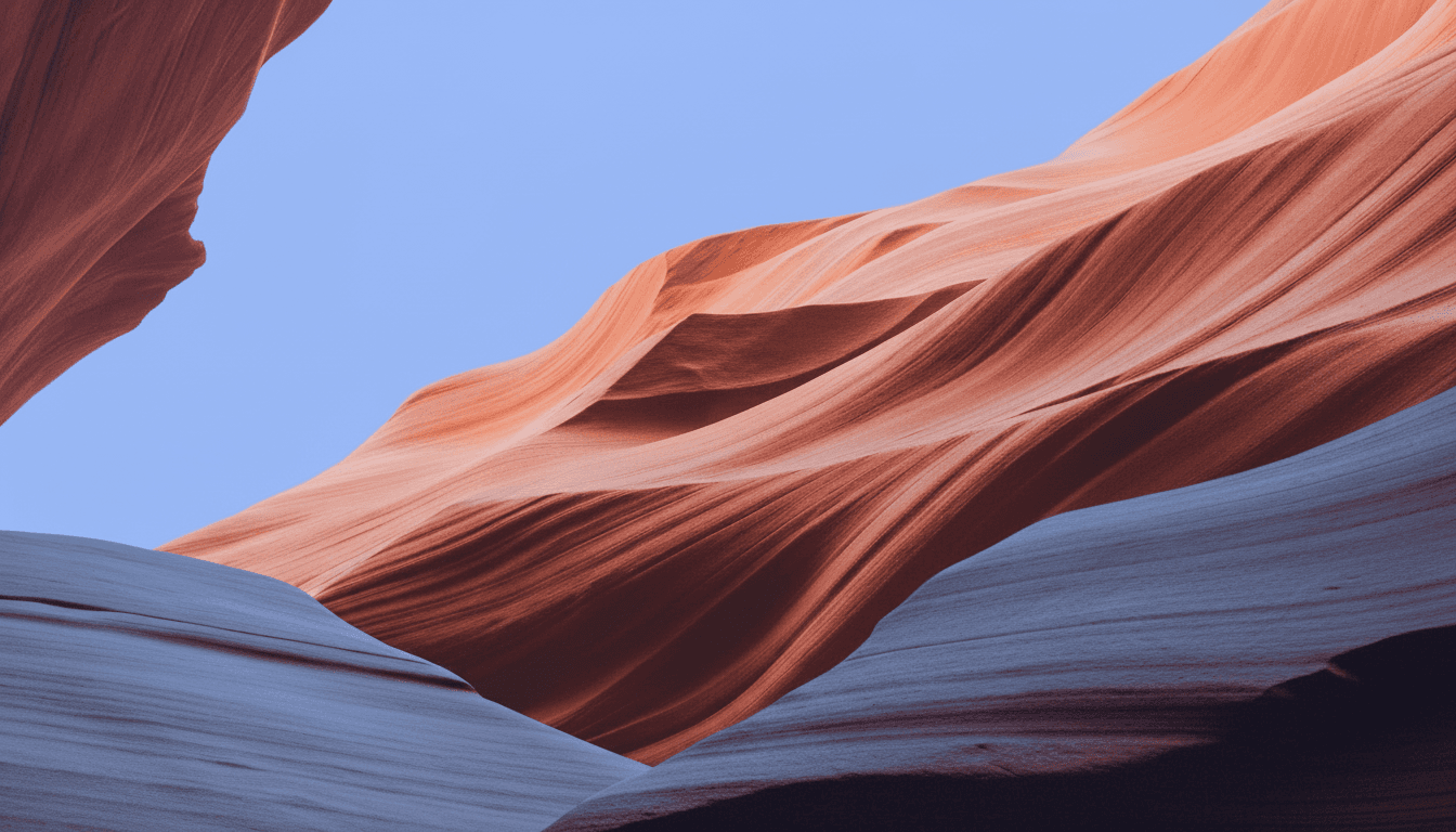 Abstract art featuring flowing shapes in shades of blue and light gray against a dark background.