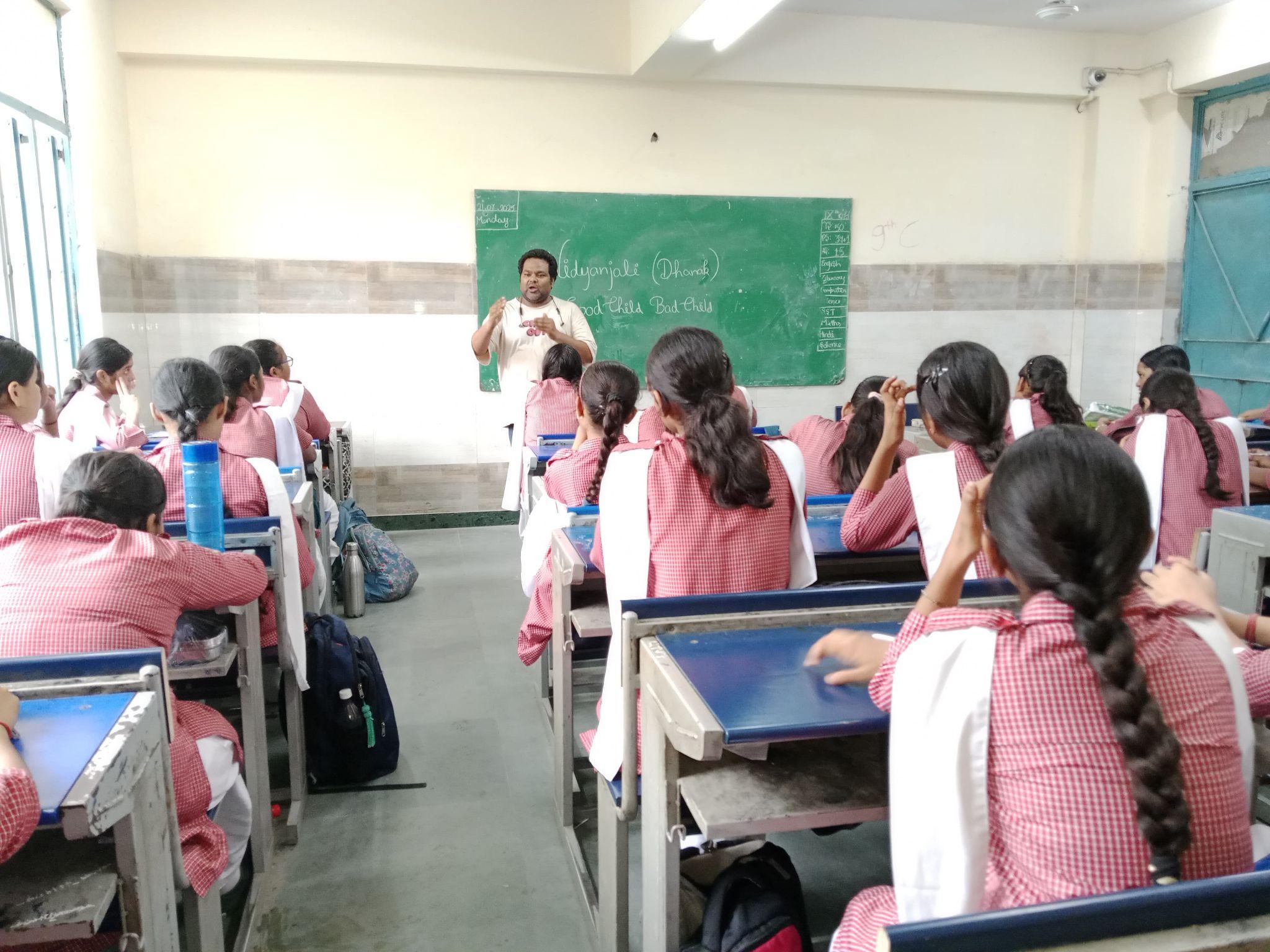 A close-up view of dark green leaves, creating a lush, textured background with subtle variations in color.